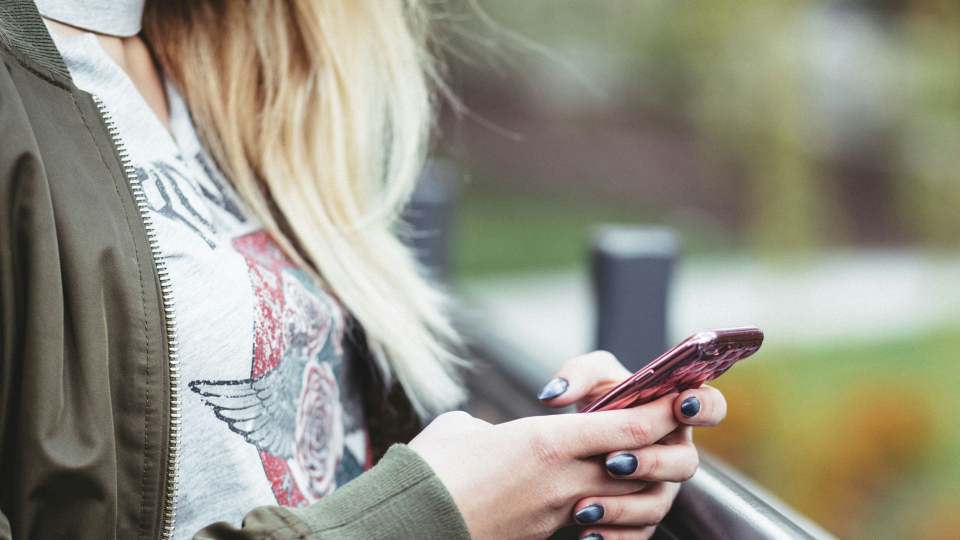 woman holding red phone