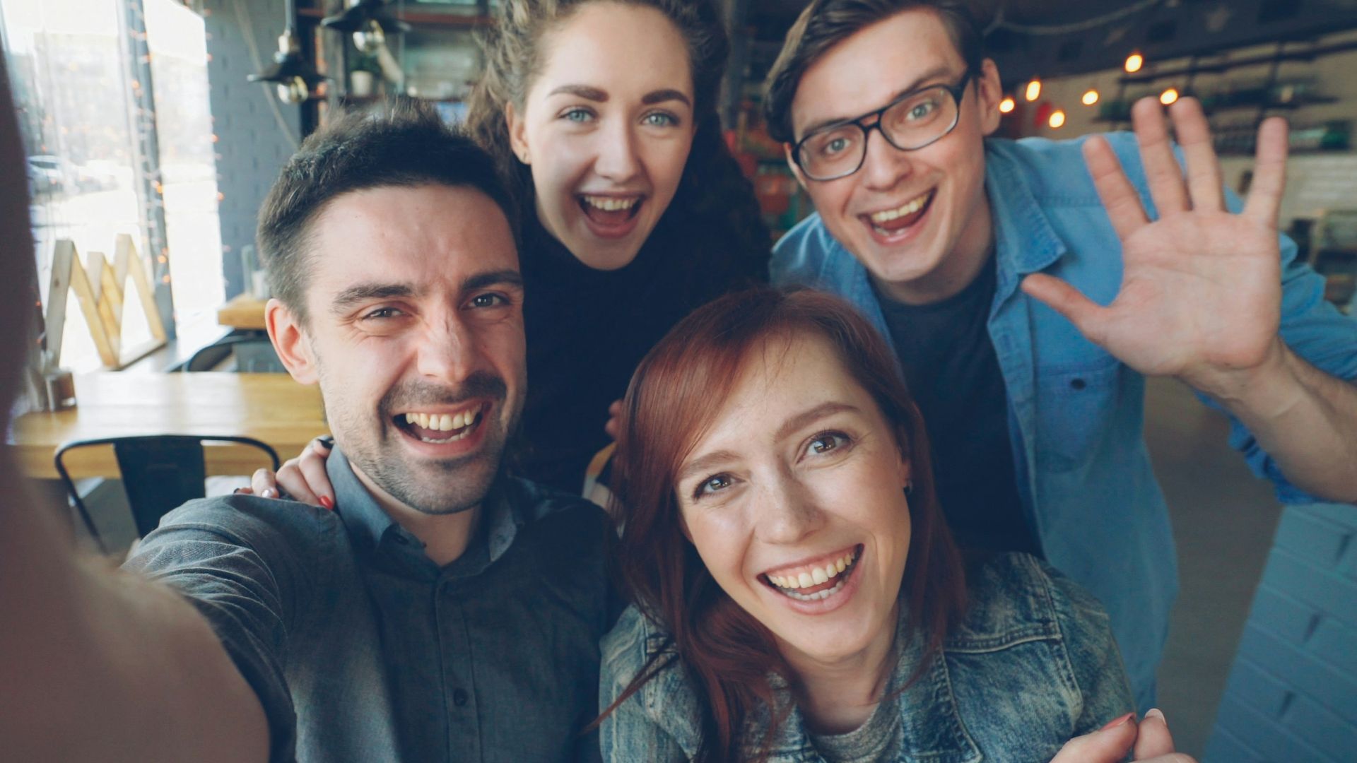 Friends happily take a selfie together.