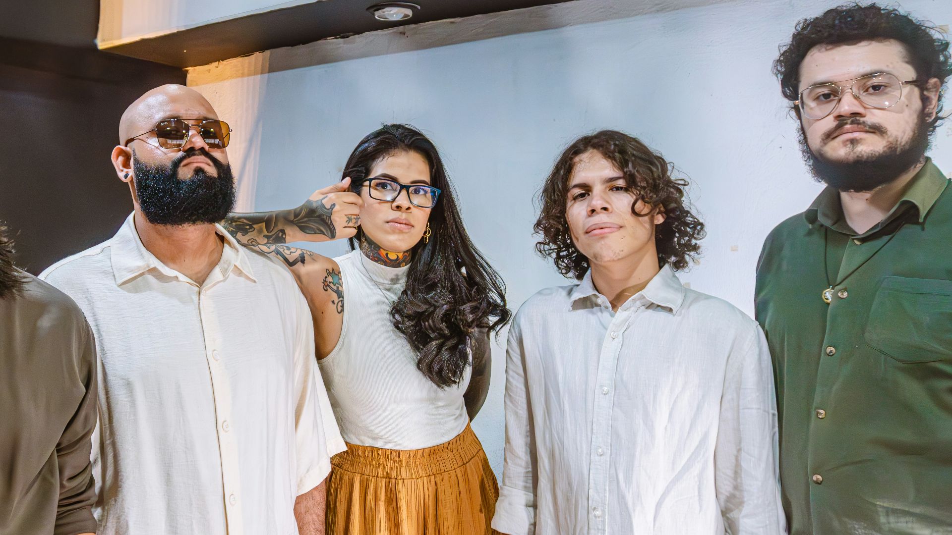 Five people posing for a group shot