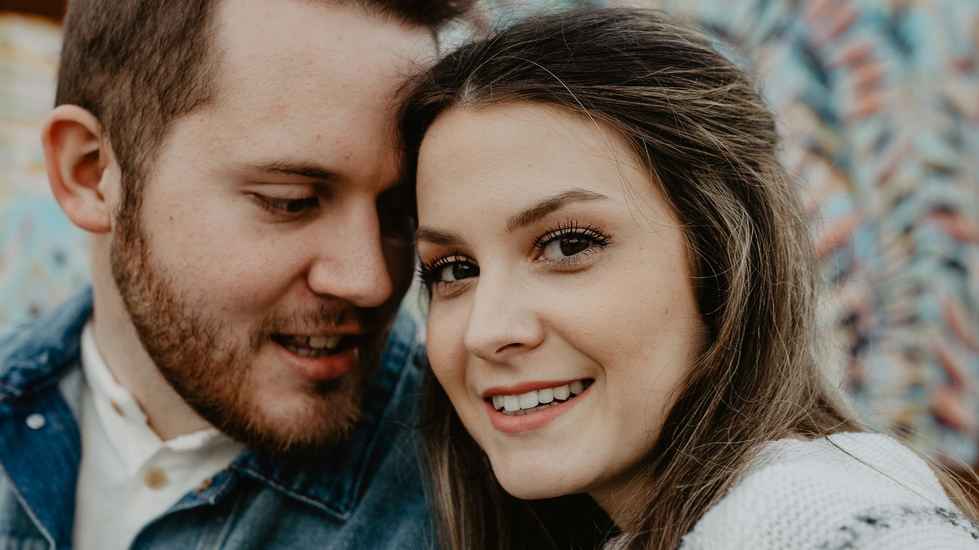 woman and man wearing white sweater
