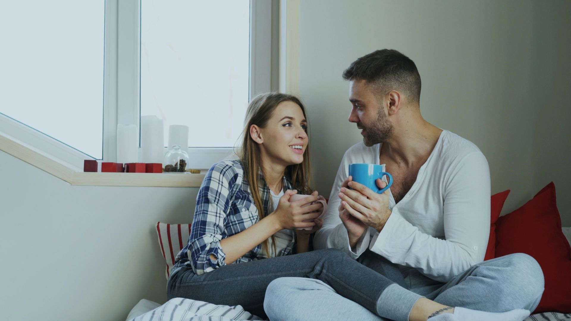 Couple enjoying drinks by the window