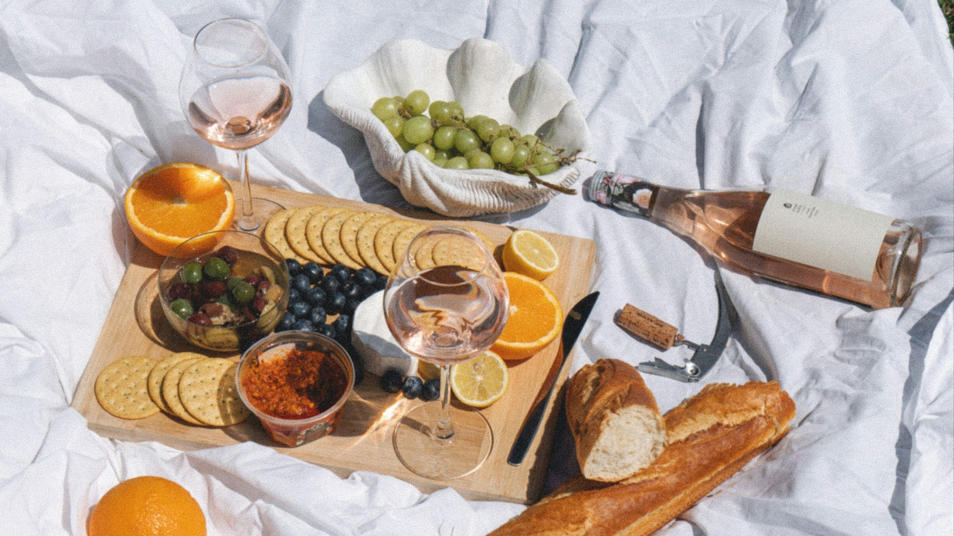 sliced orange fruit on white textile