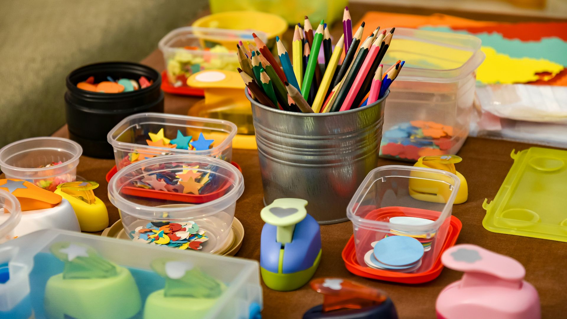 assorted color pencils in clear plastic container