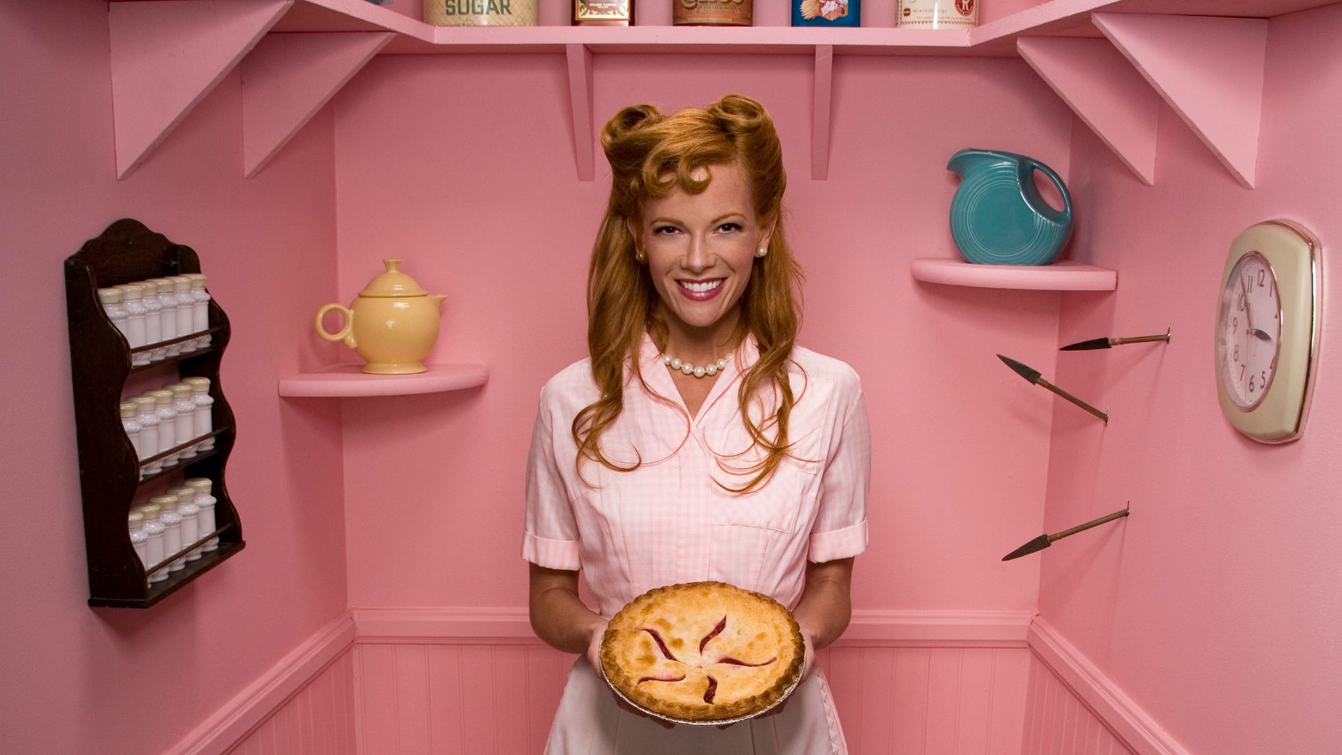 woman holding pie in storage room