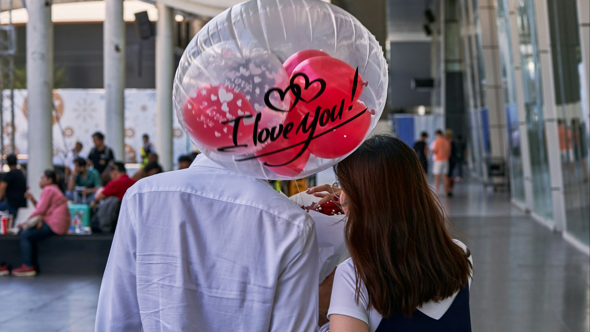 a man and a woman walking down a street