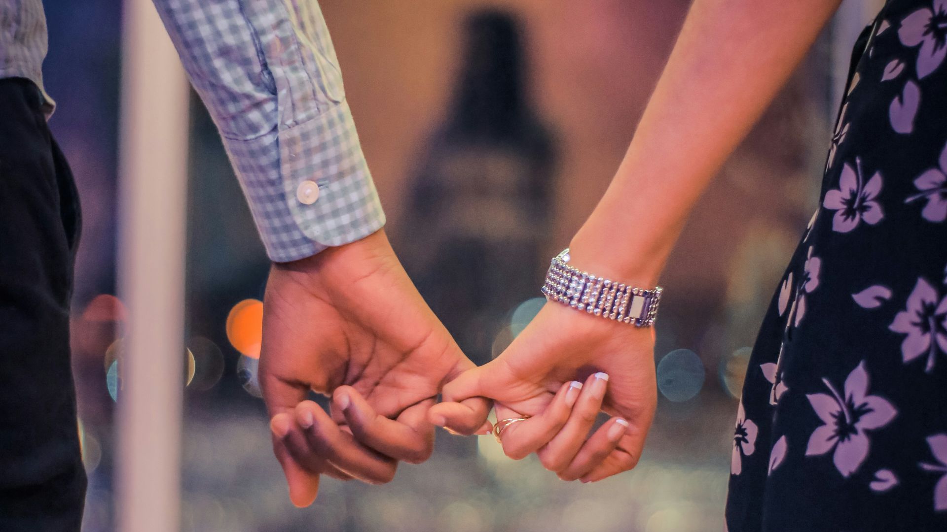 man and woman holding hands