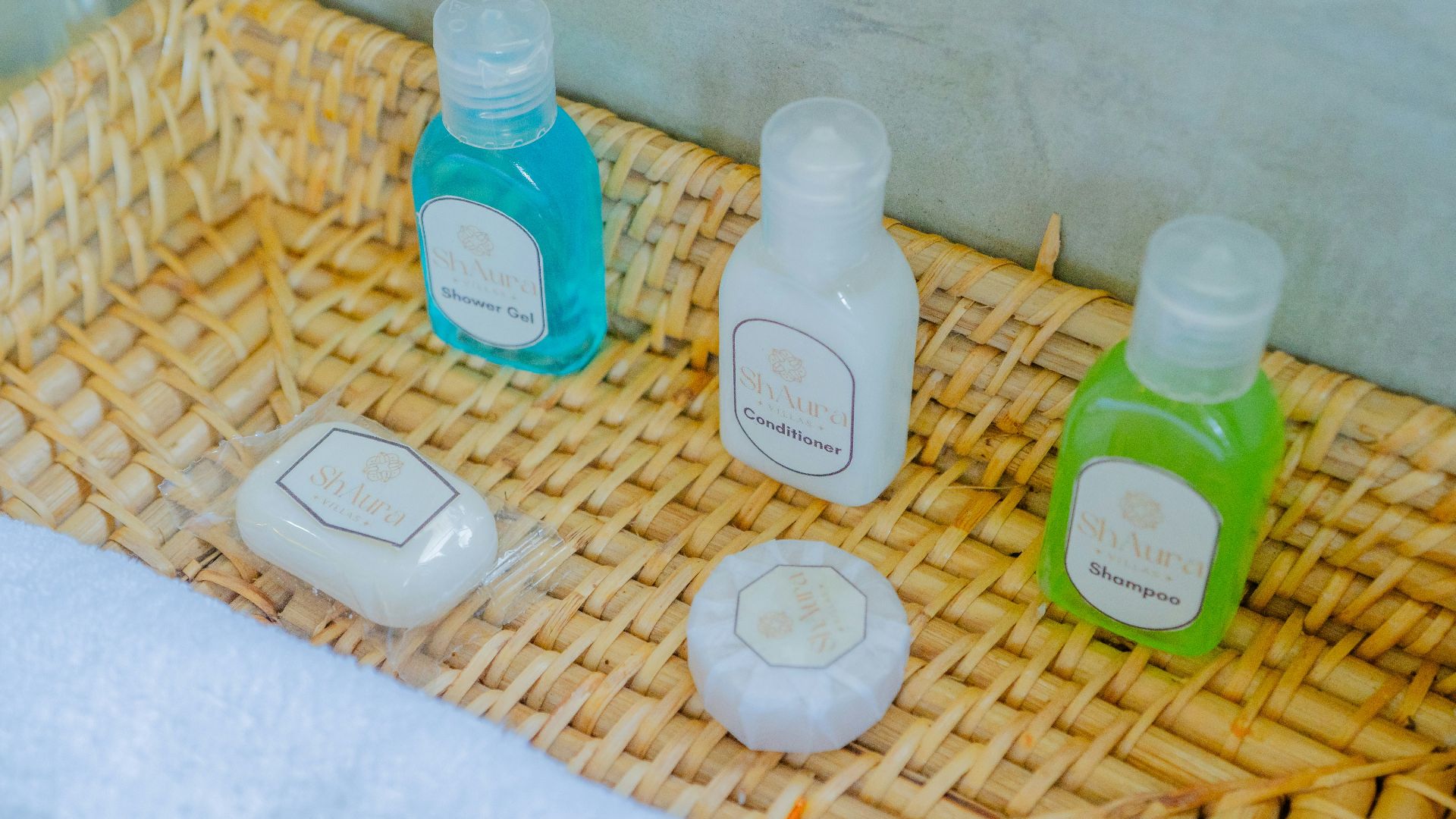 Bath products are neatly arranged in a woven basket.