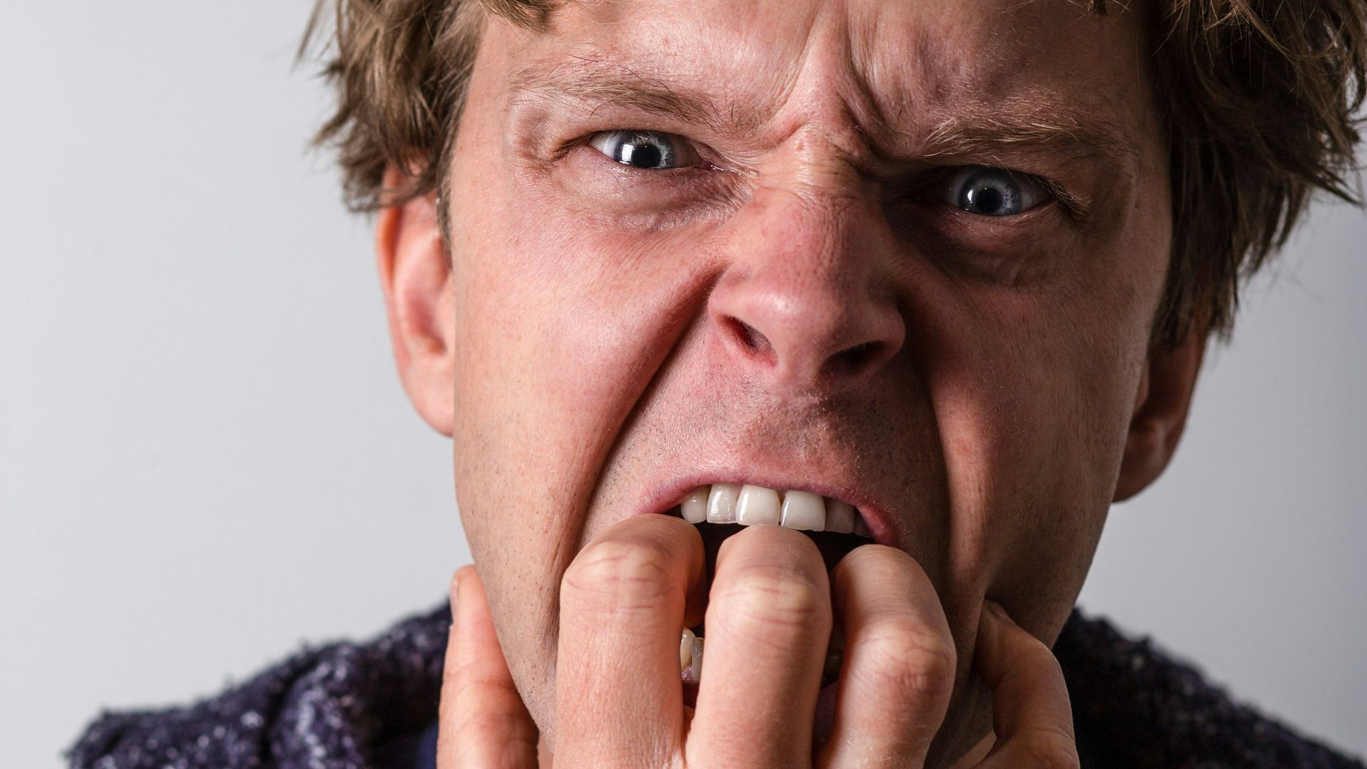 man in blue and white long sleeve shirt