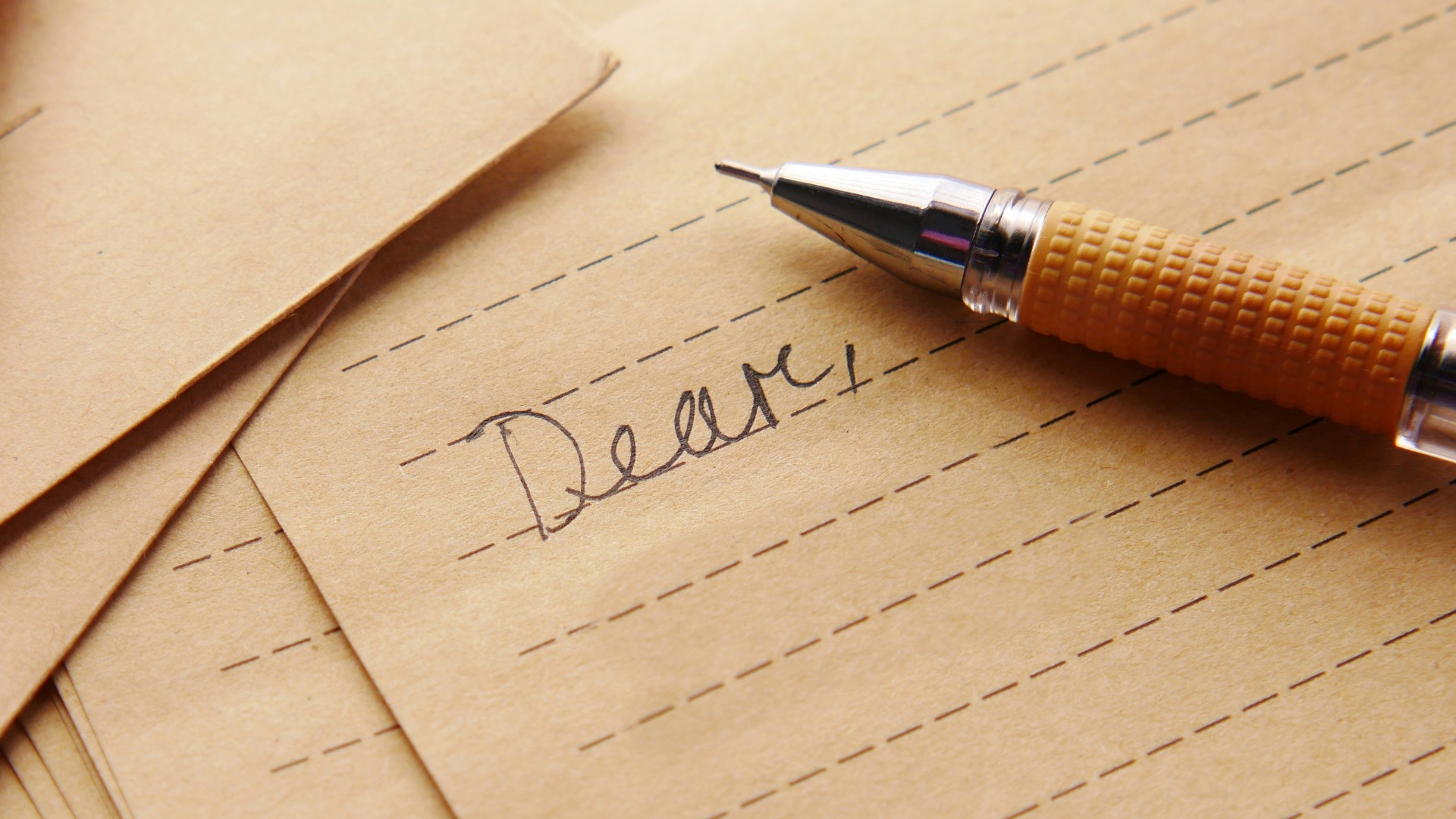 a pen sitting on top of a piece of paper