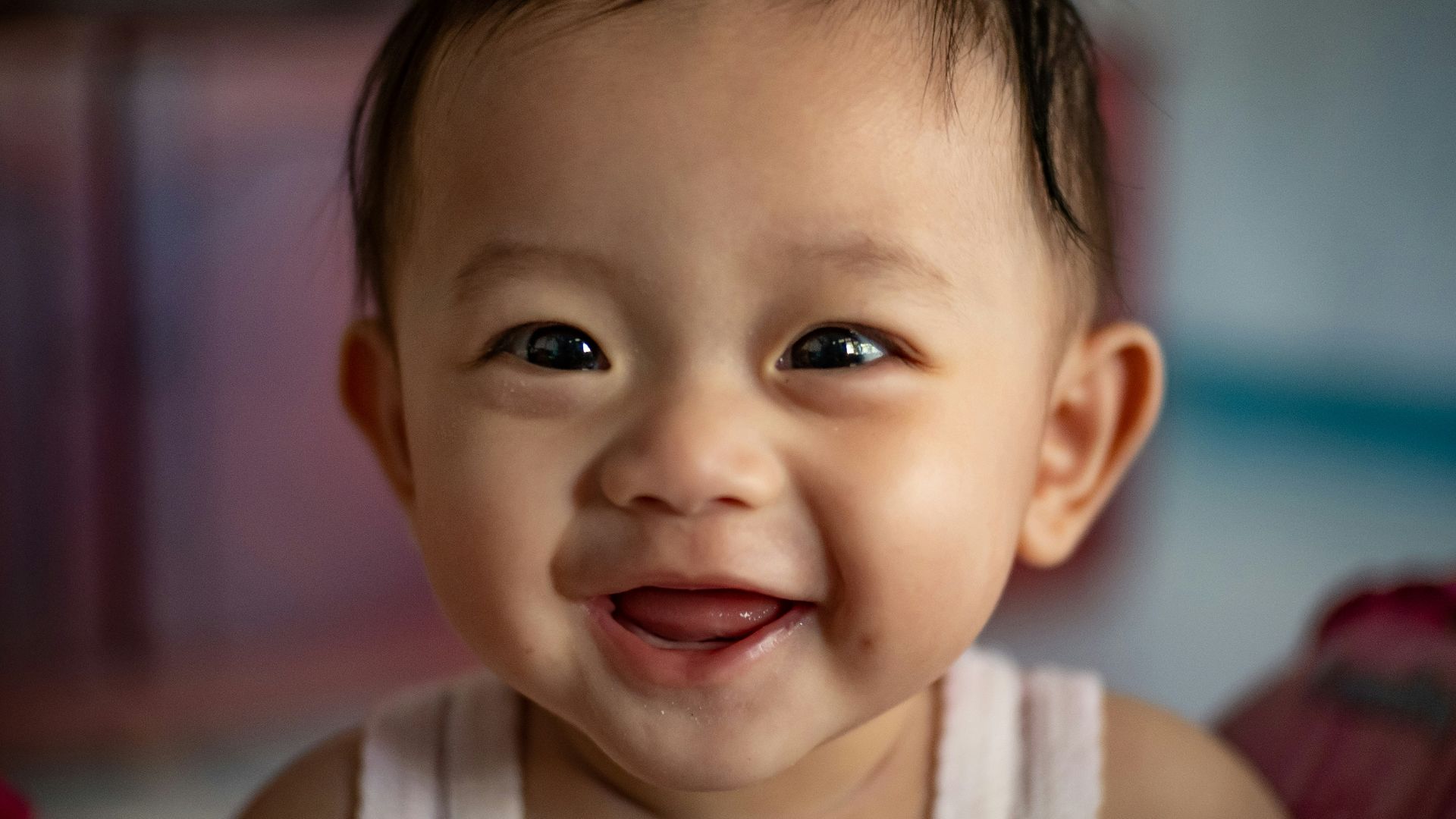 child in white tank top