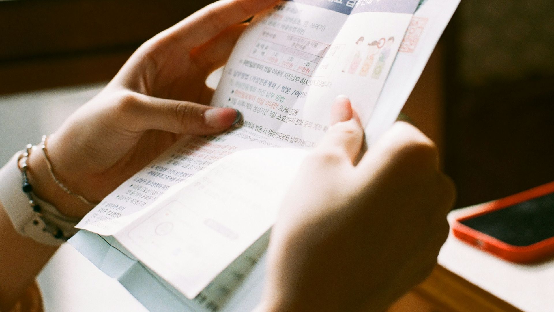 person holding white printer paper