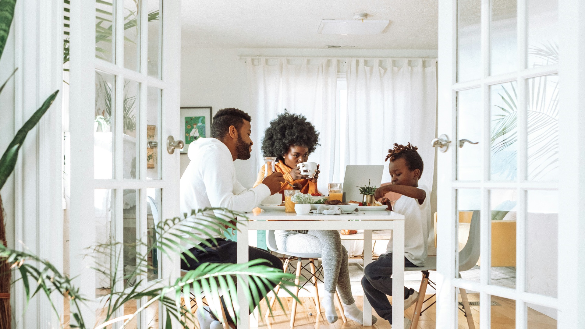 people sitting on chairs in front of table