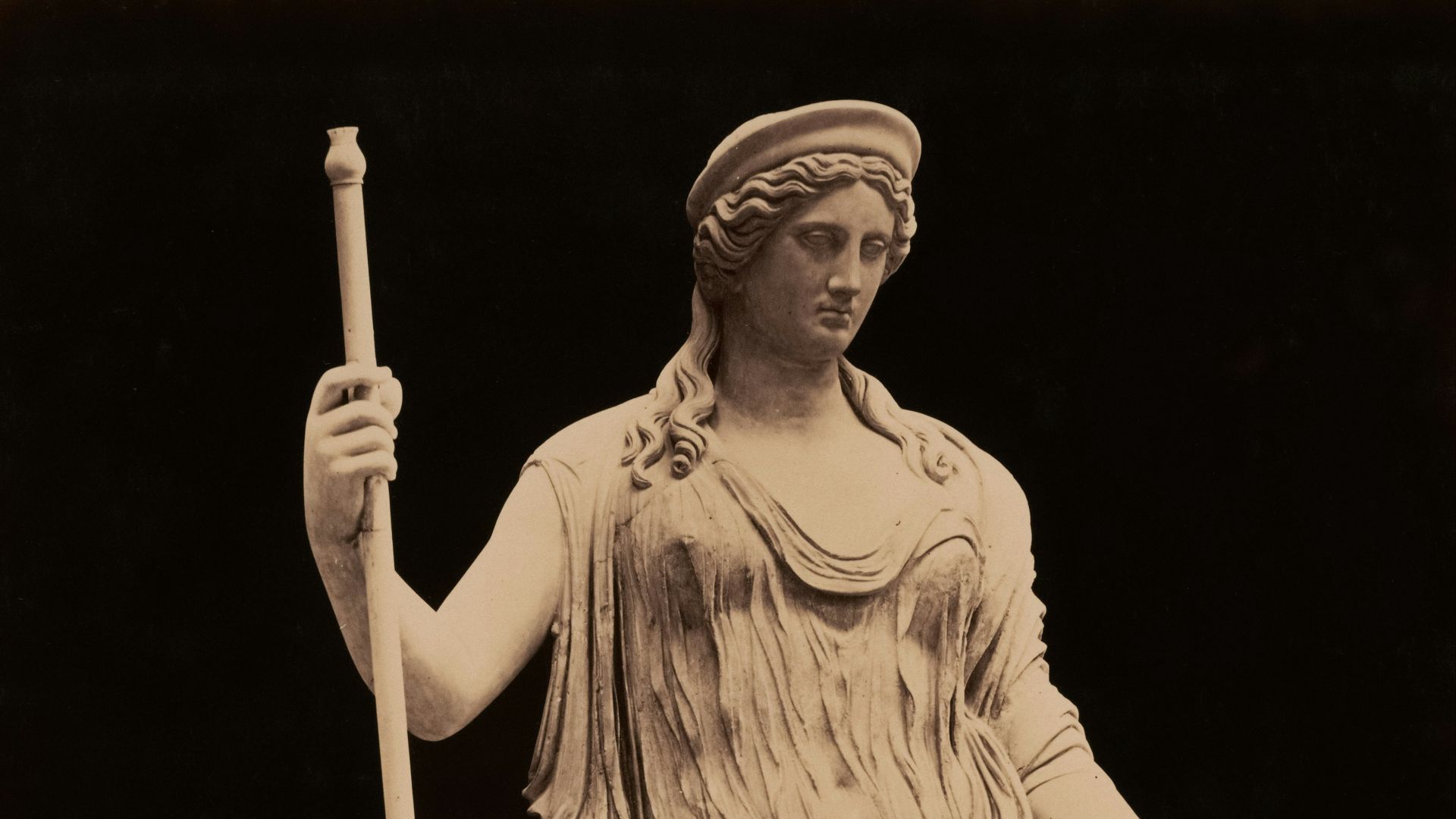 A beautiful statue of a goddess is pictured.