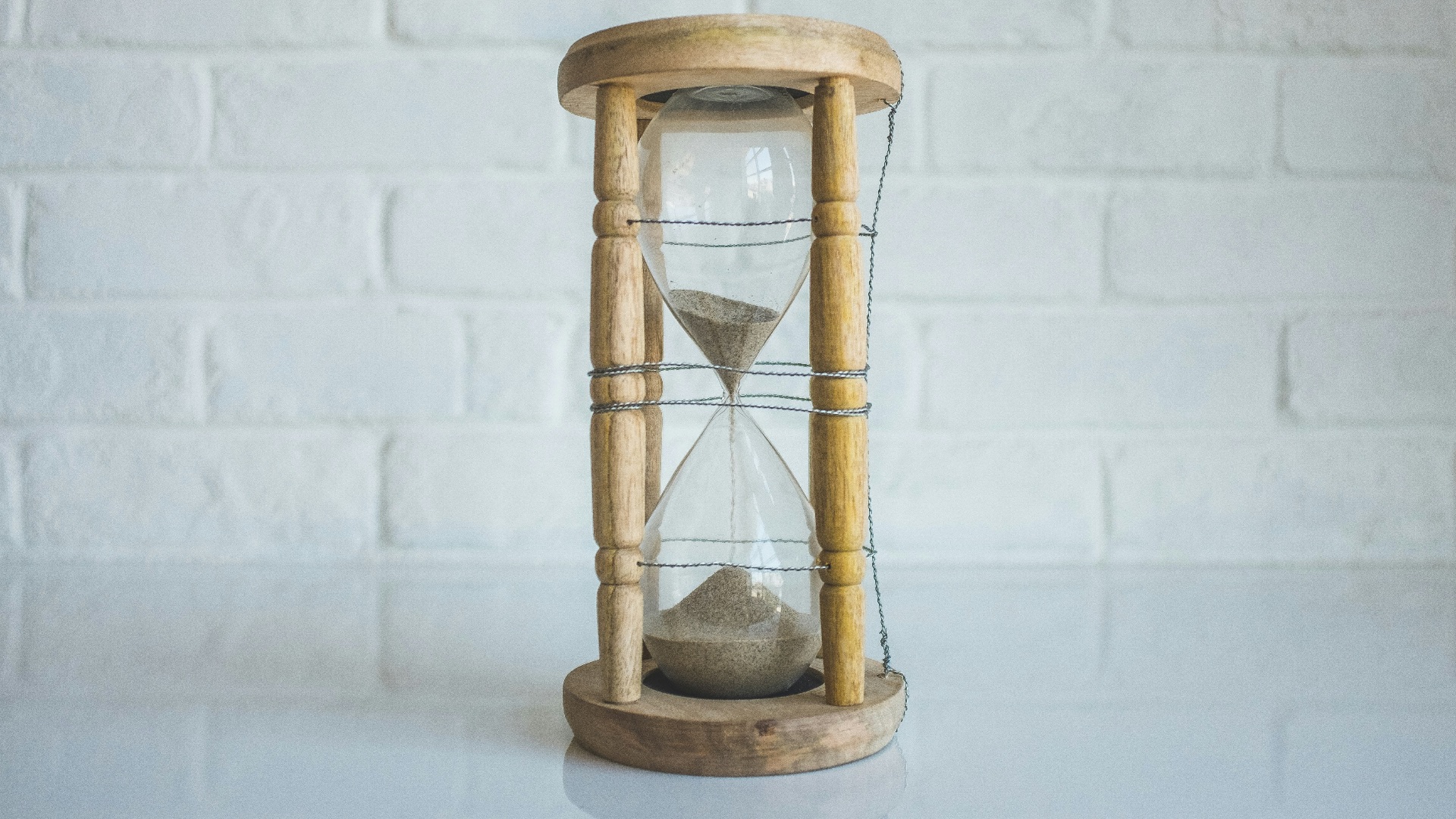 clear hour glass with brown frame