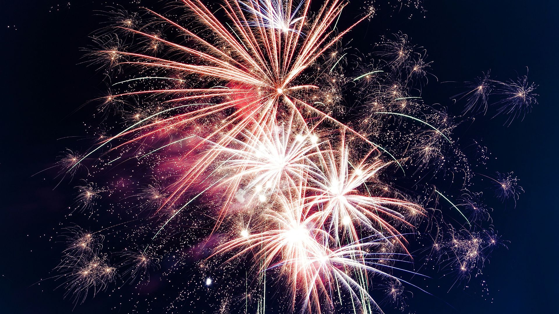 time lapse photography of fireworks at night