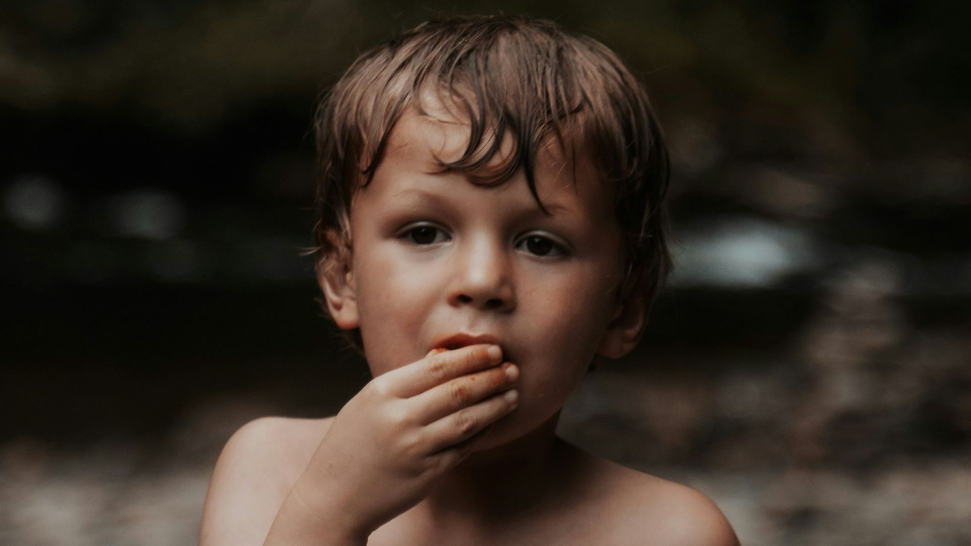 topless baby with brown eyes