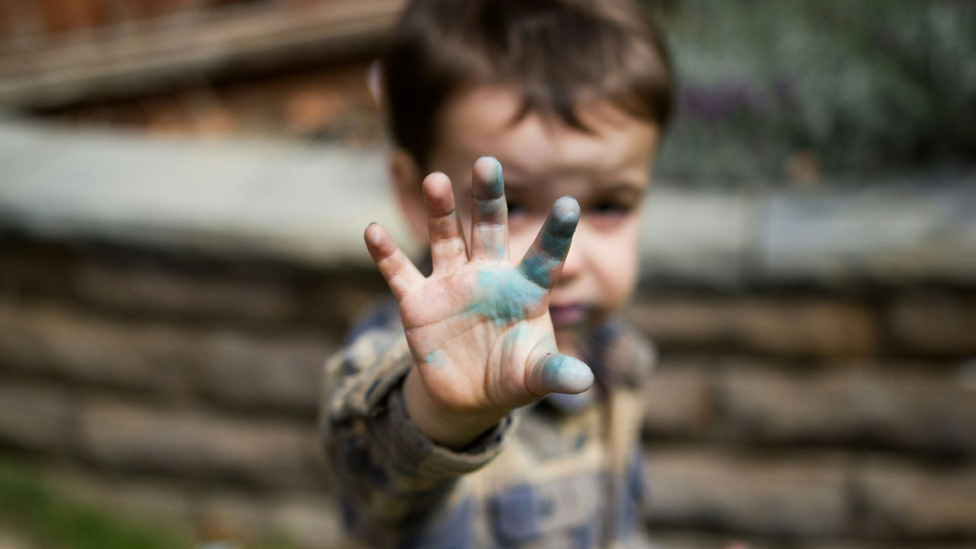 man in brown and black camouflage jacket