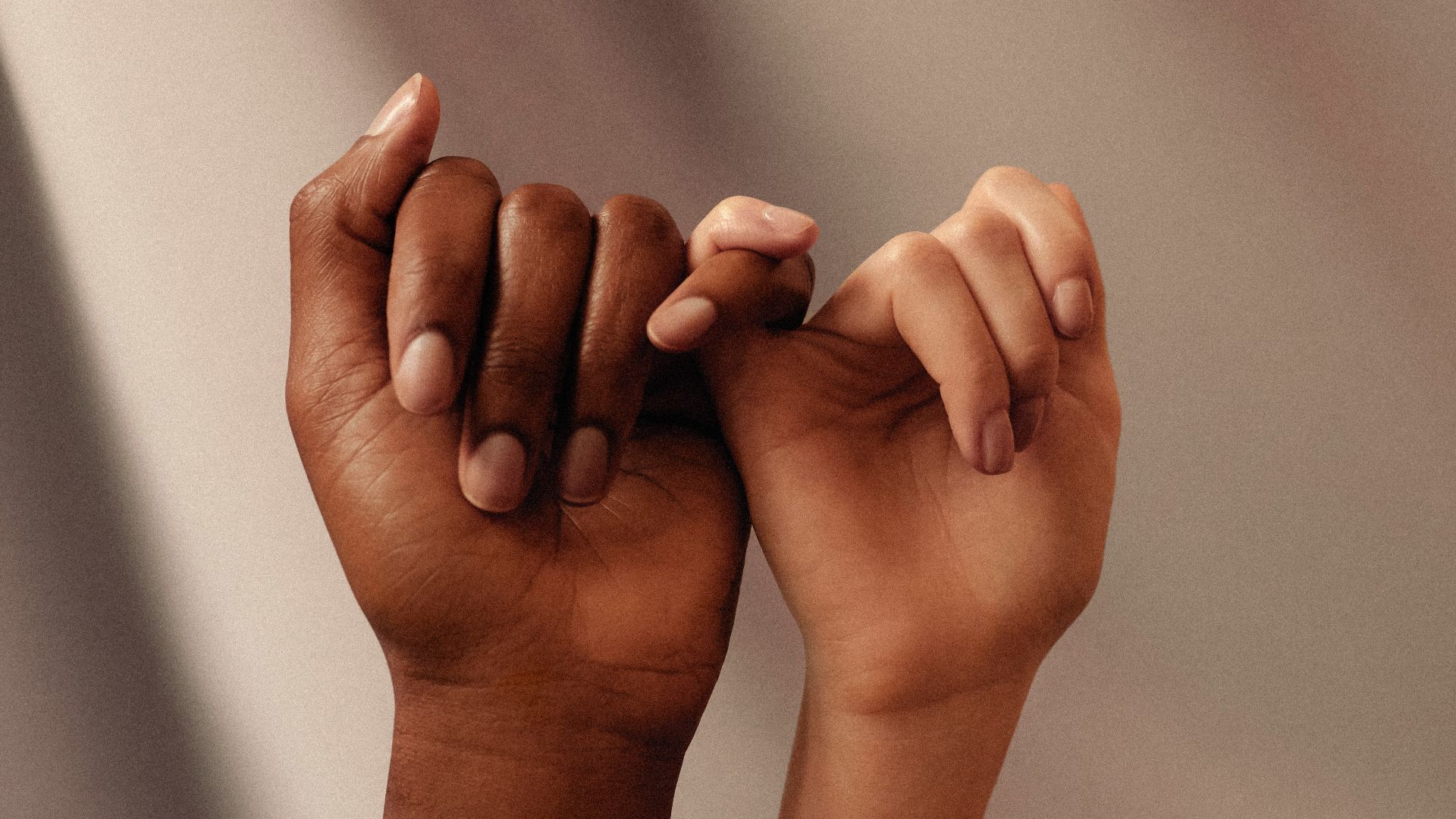 persons hand with white manicure