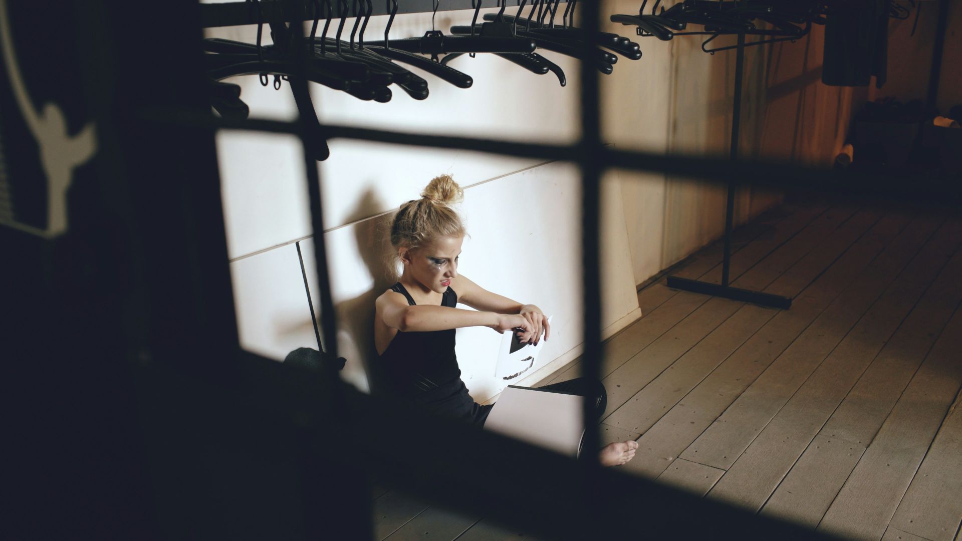 Woman sitting on floor with guitar