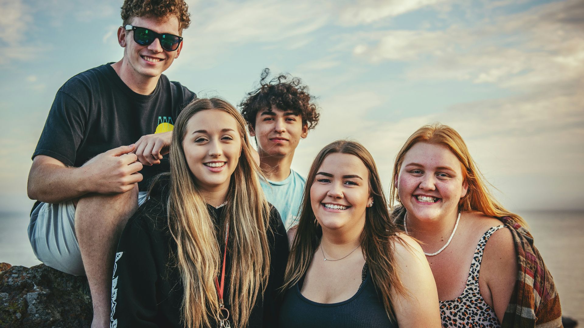 photography of five people near outdoor during daytime