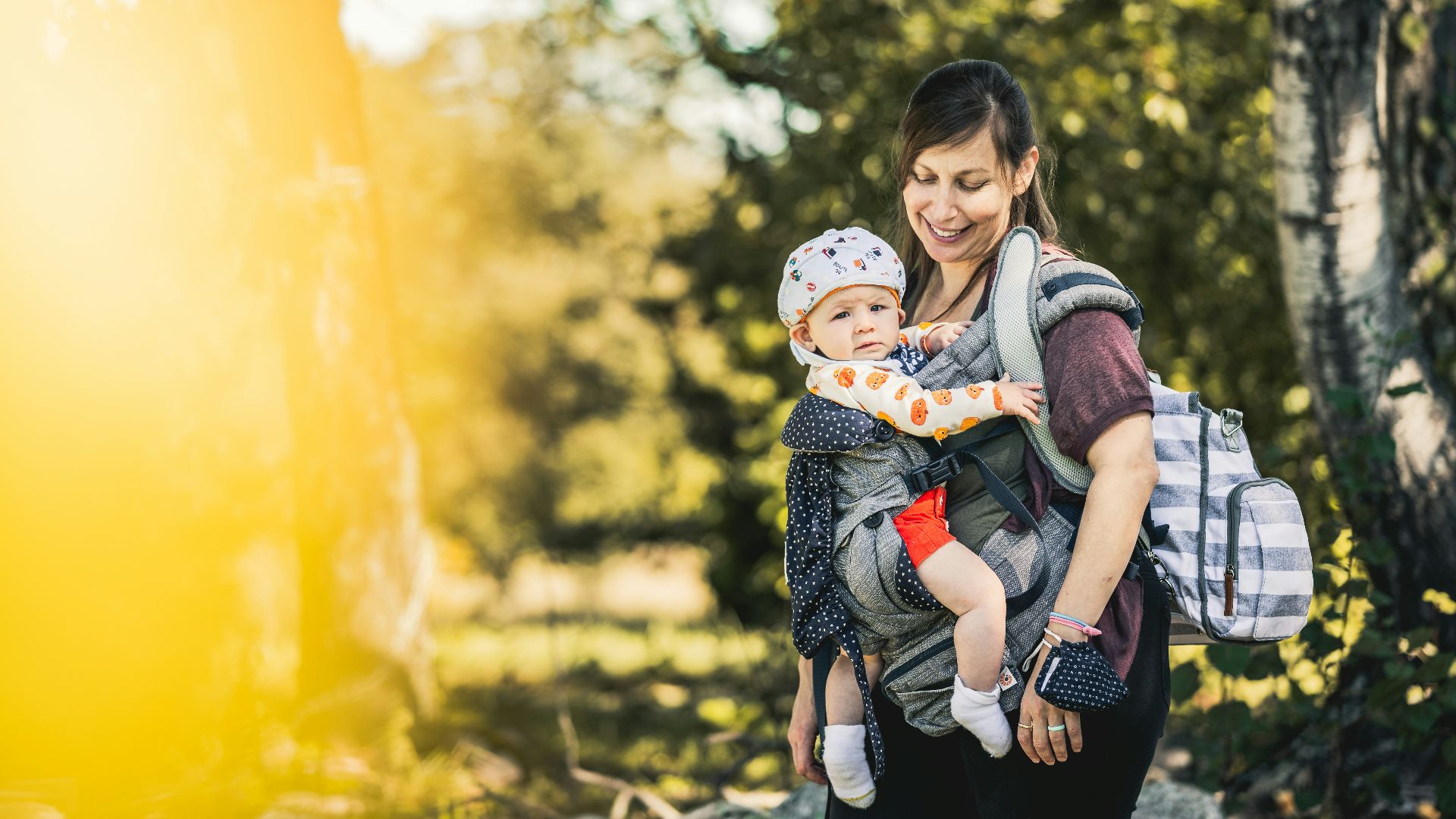 a woman holding a child in her arms