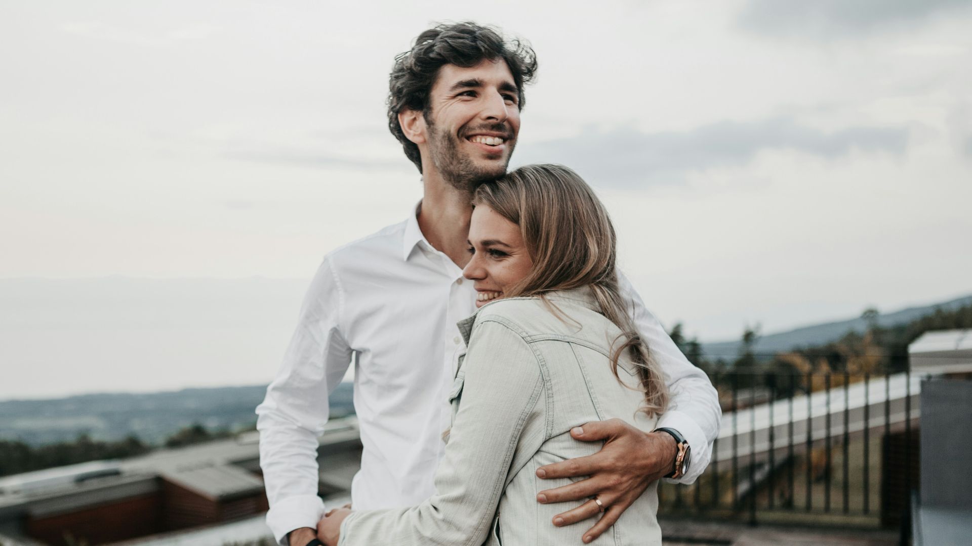 man and woman hugging each other