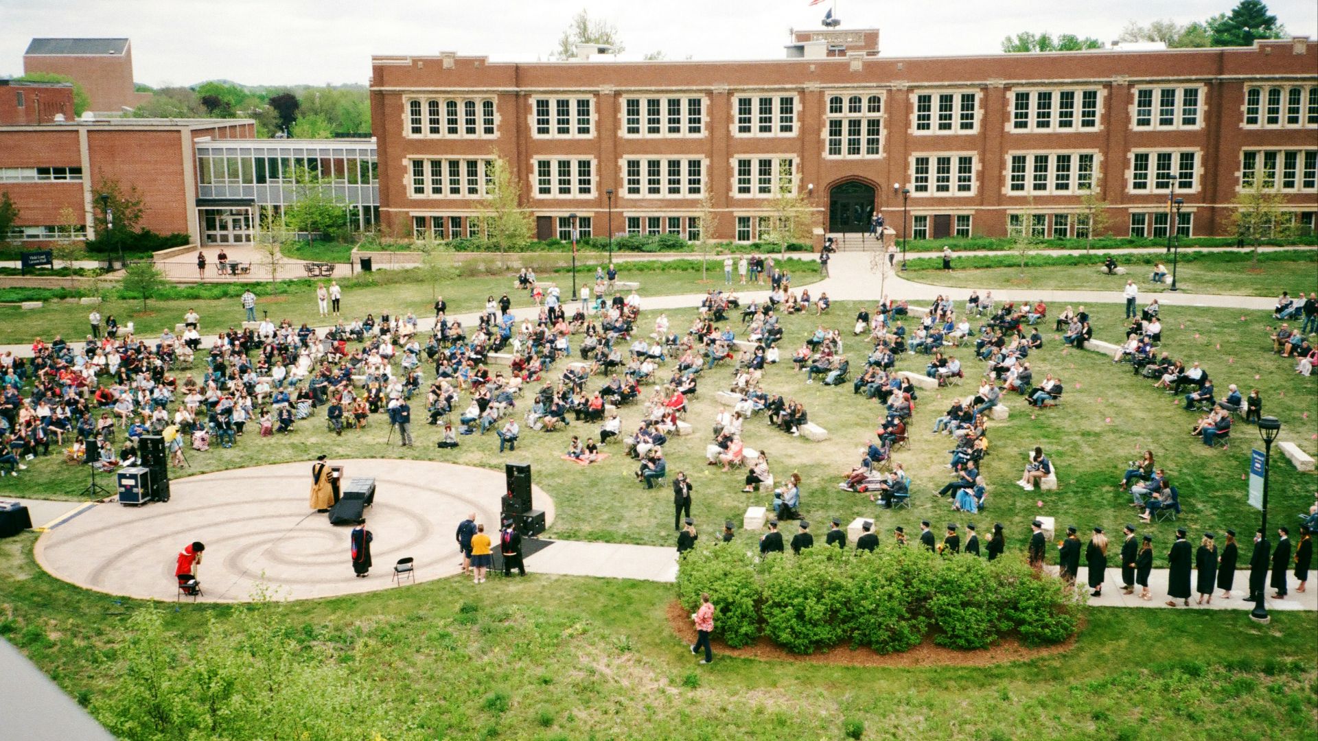 people in front of brown building during daytime