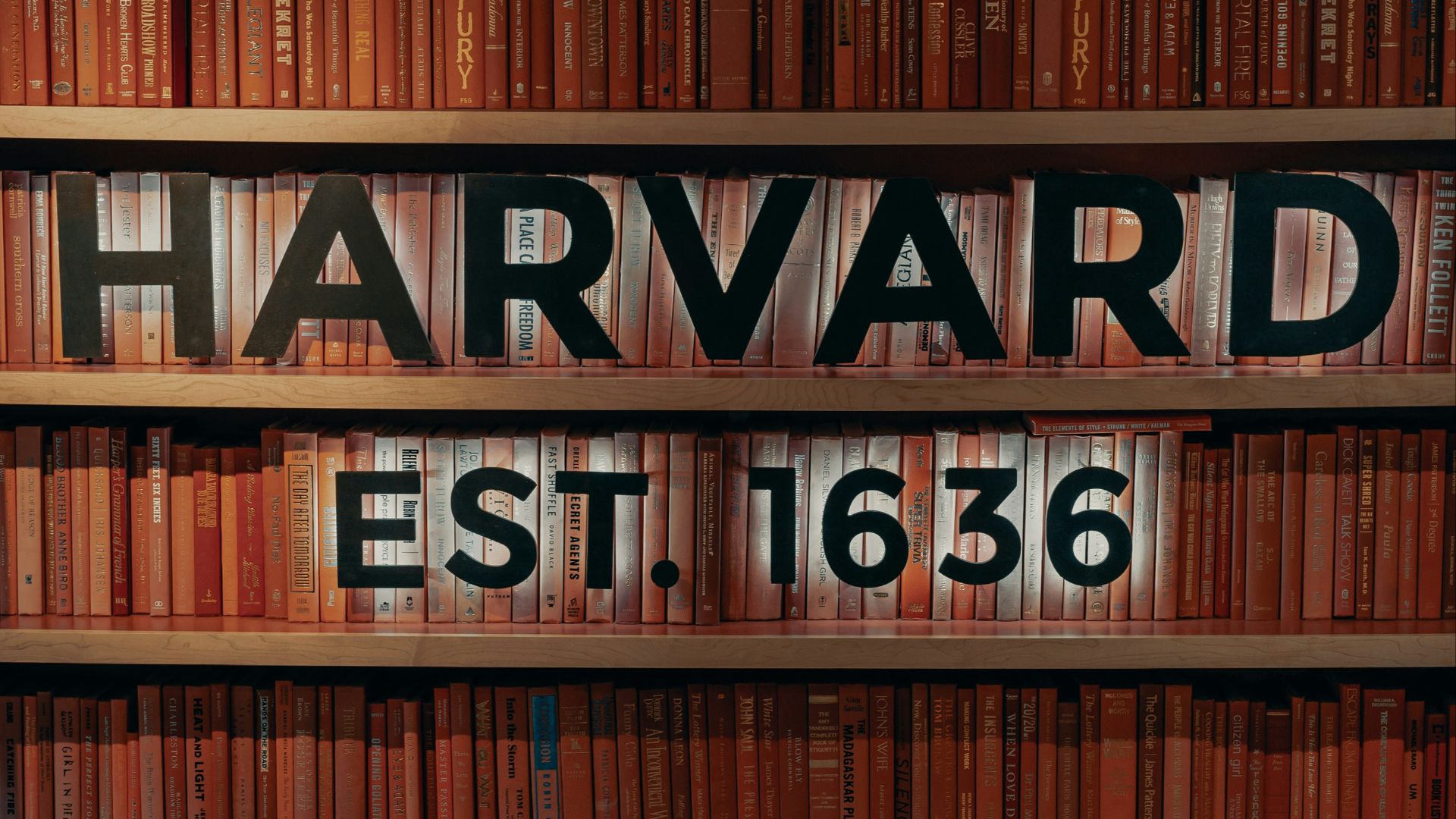 a chair and table in front of a bookshelf