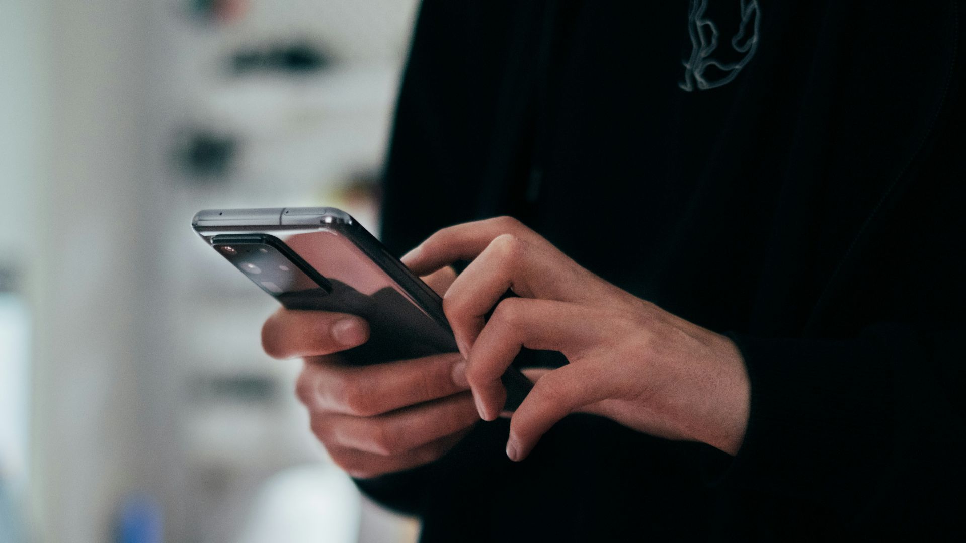 person holding black android smartphone