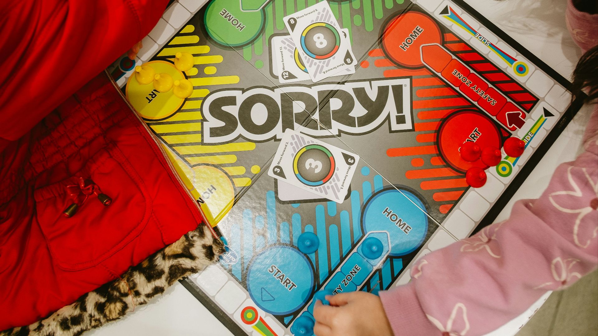 Children playing the board game sorry!
