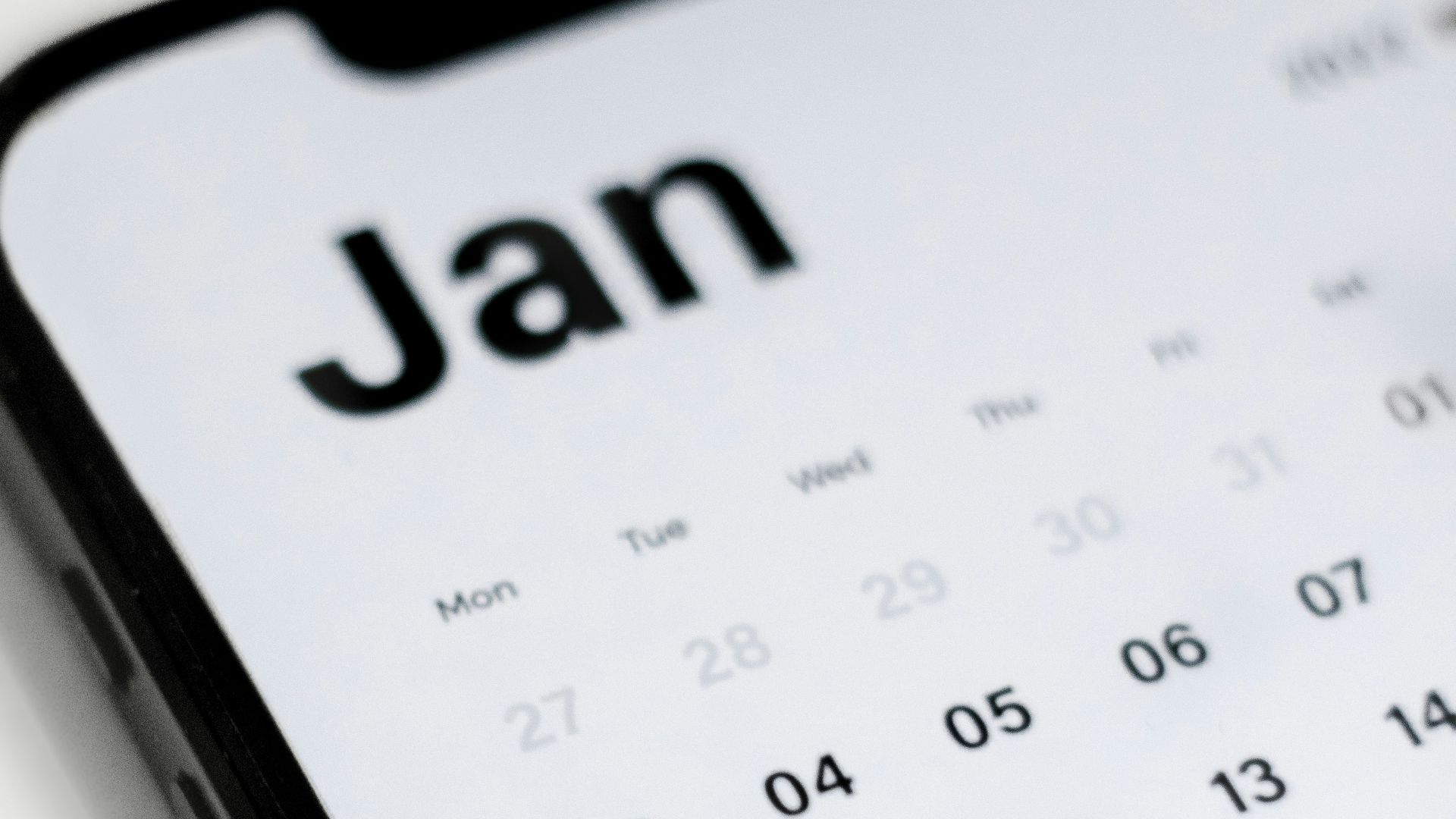 a close up of a cell phone with a calendar on it