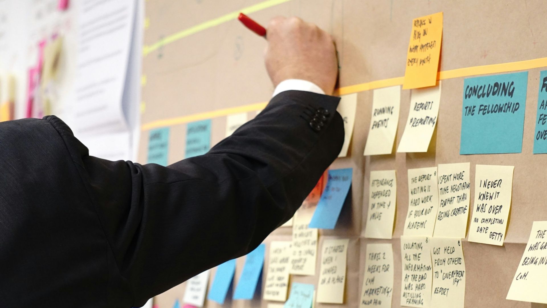 sticky notes on corkboard