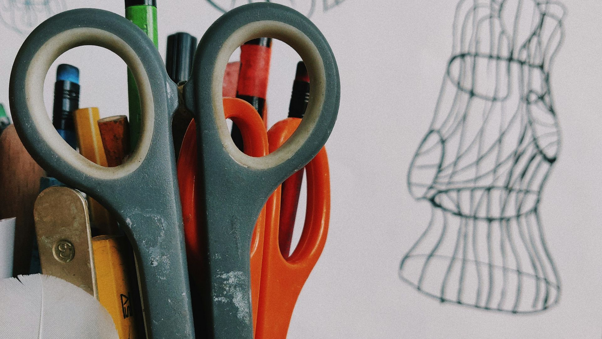 pen and scissors in vase