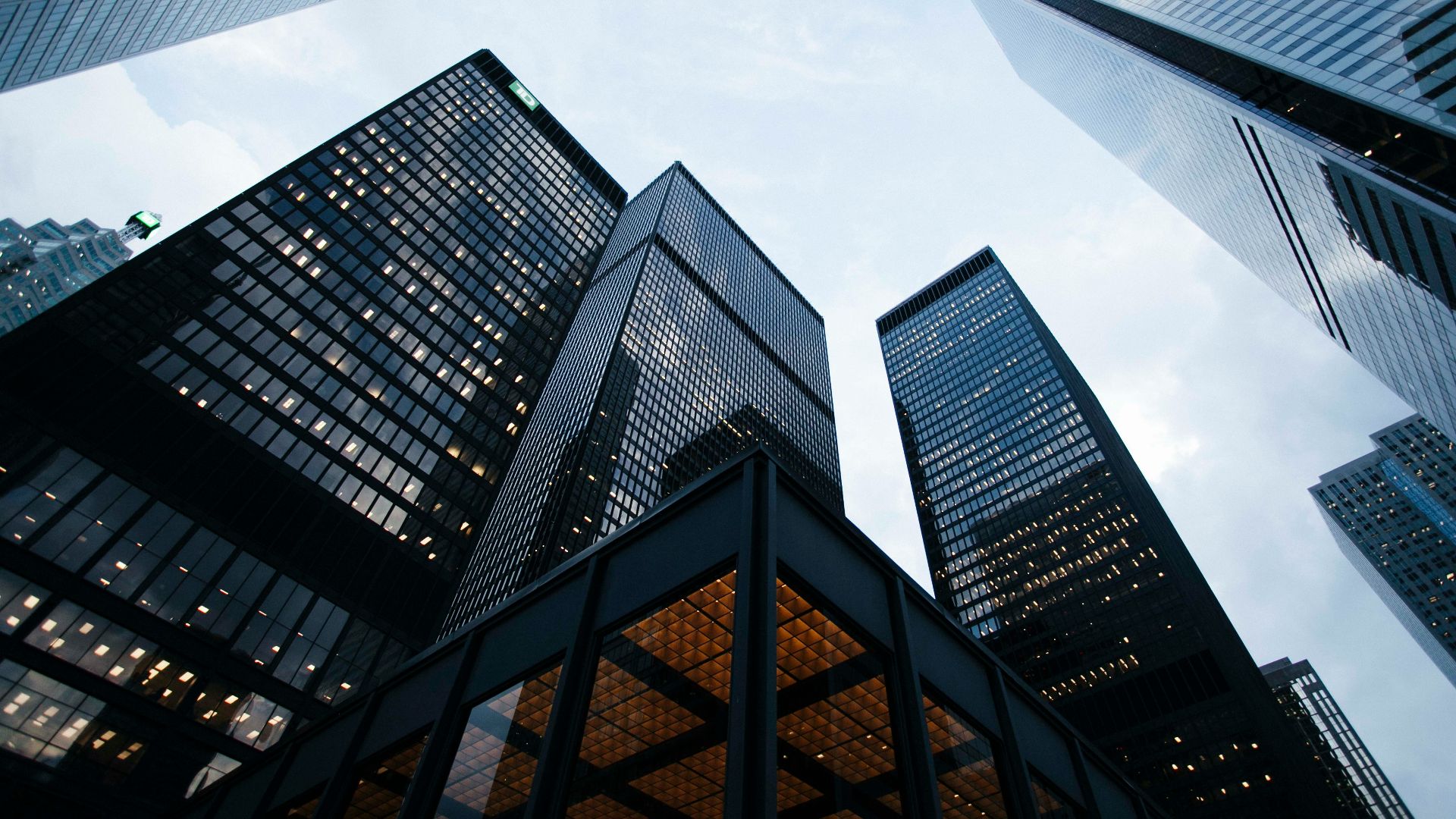 low angle photo of city high rise buildings during daytime