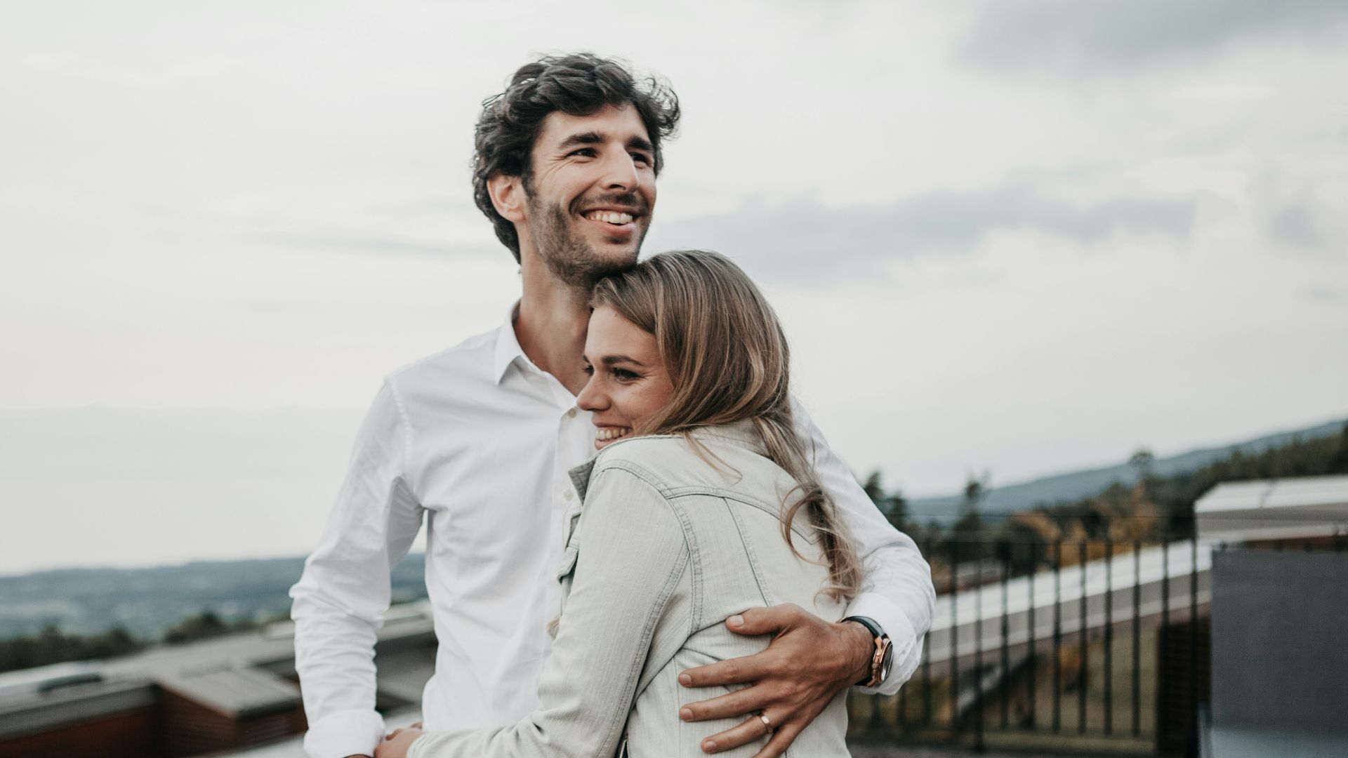 man and woman hugging each other