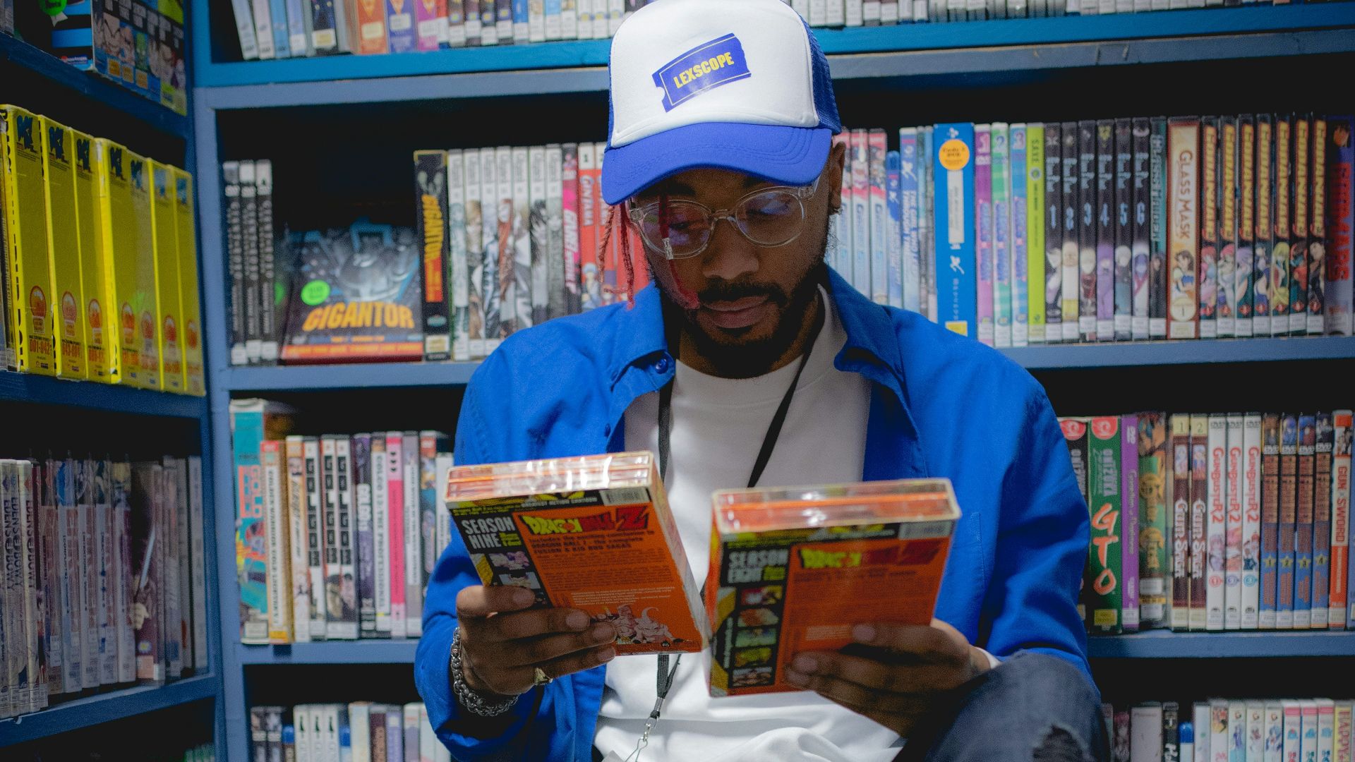 a man sitting on the floor reading a book