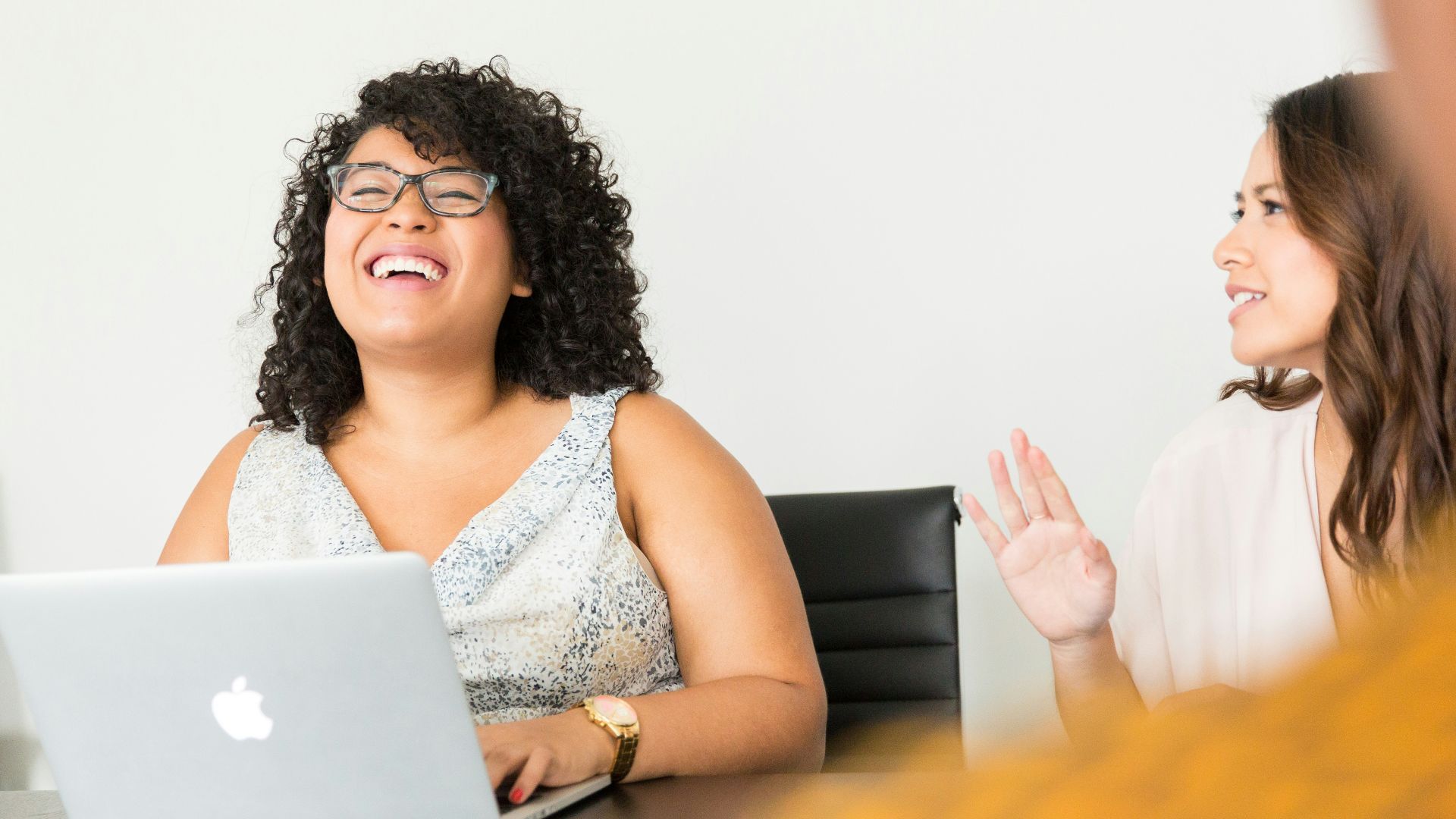woman sitting in front of the laptop