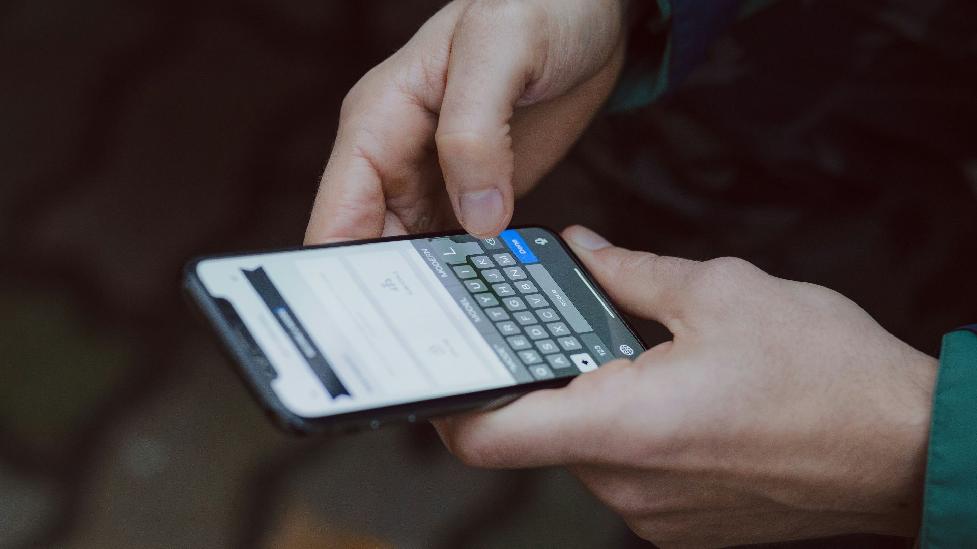 selective focus photography of person using smartphone