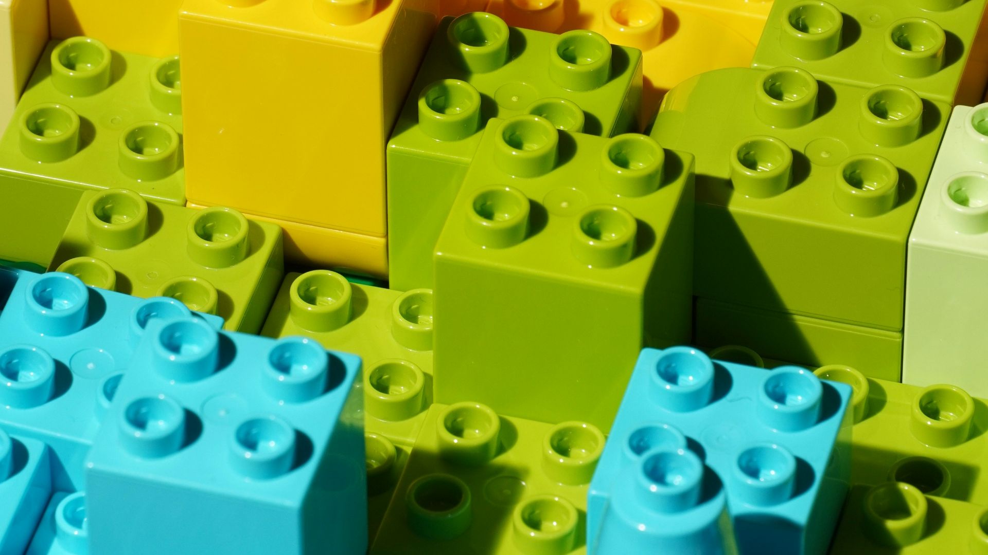 a close up of many different colored legos