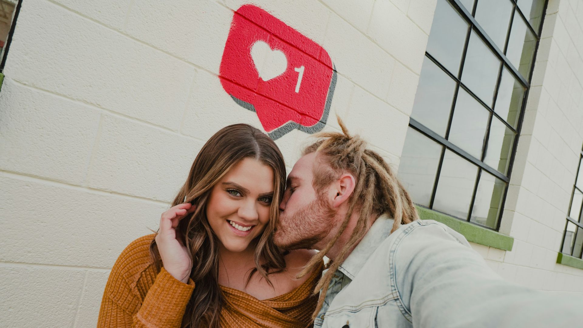 a man and a woman standing next to each other