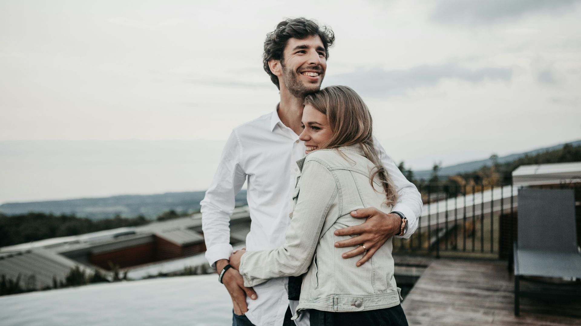 man and woman hugging each other