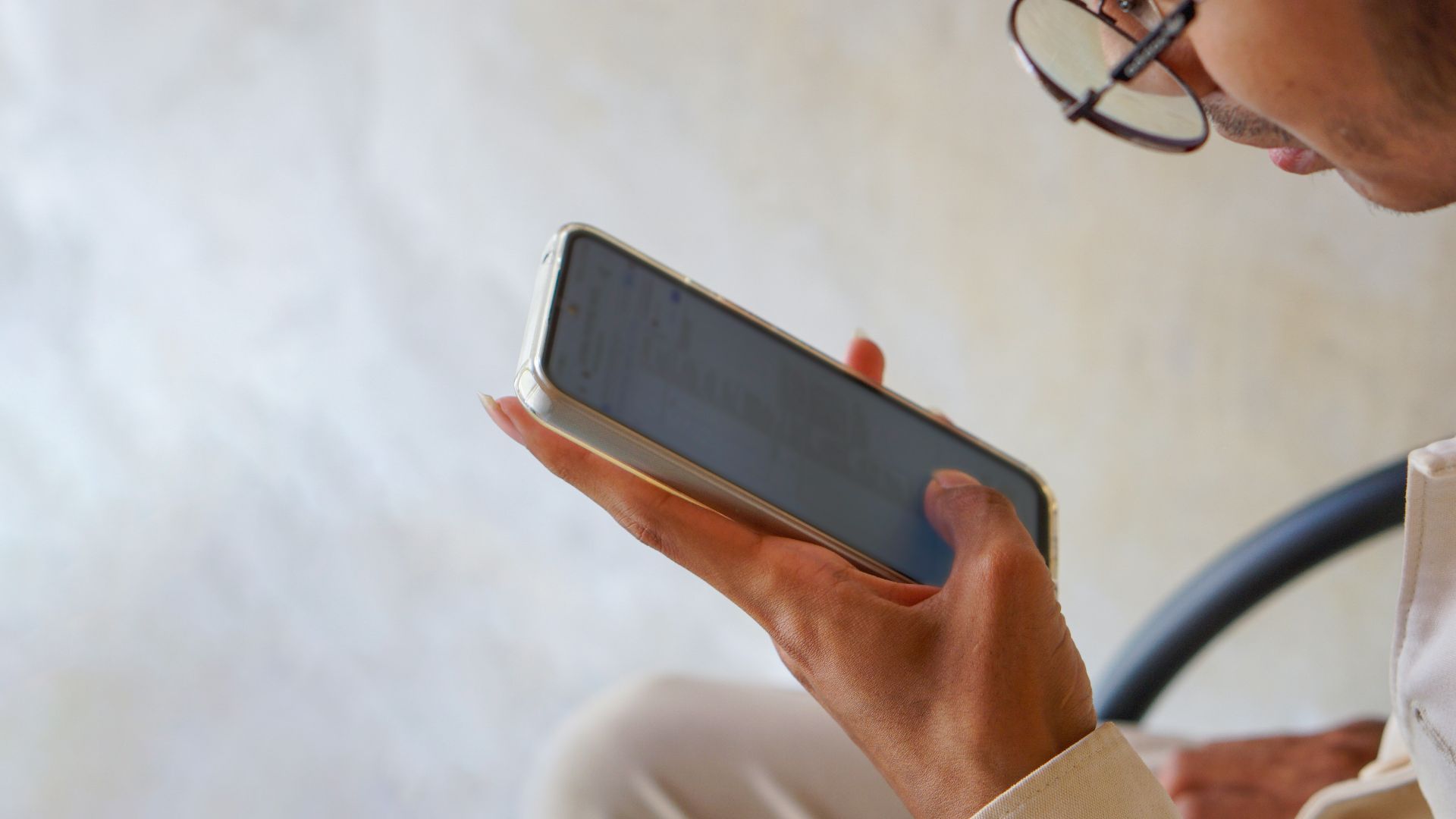a close up of a person holding a cell phone