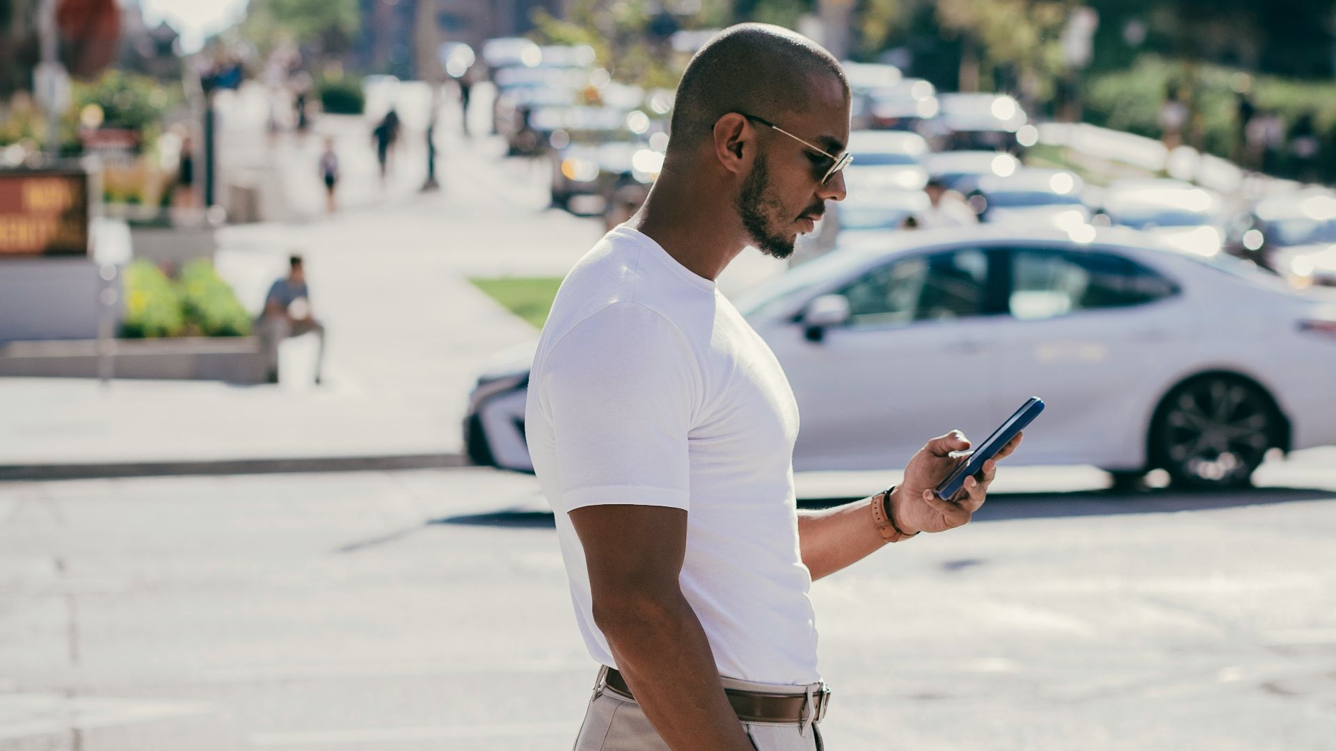 a man standing on a sidewalk
