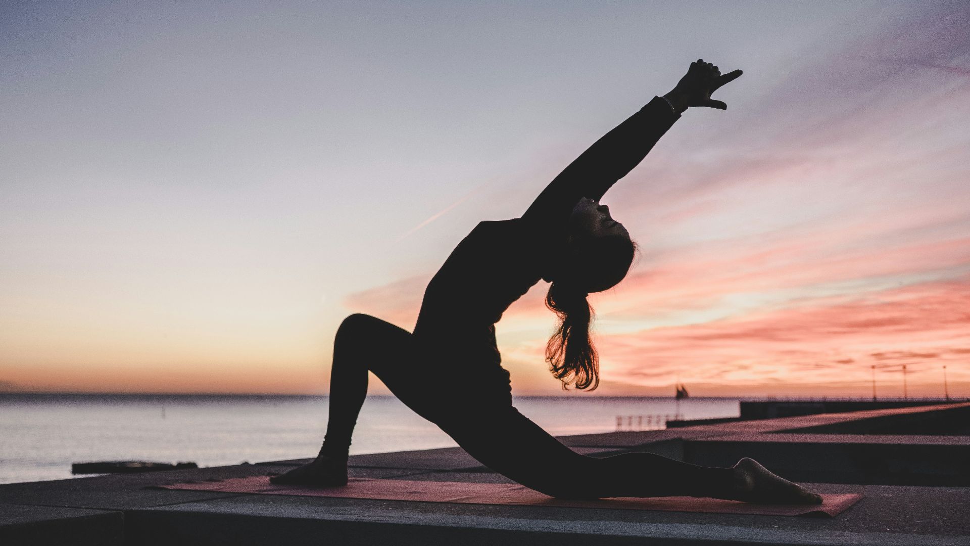 silhouette photography of woman doing yoga