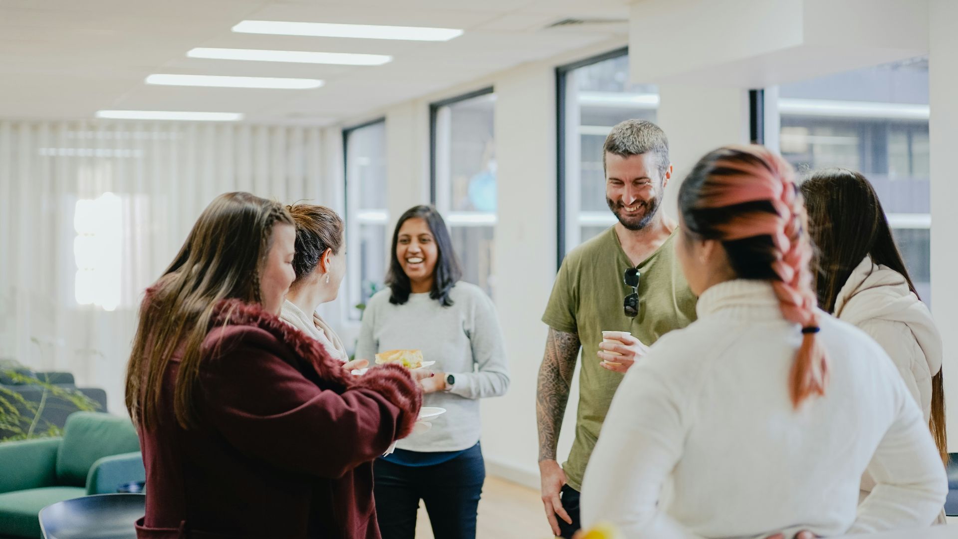 a group of people standing in a room