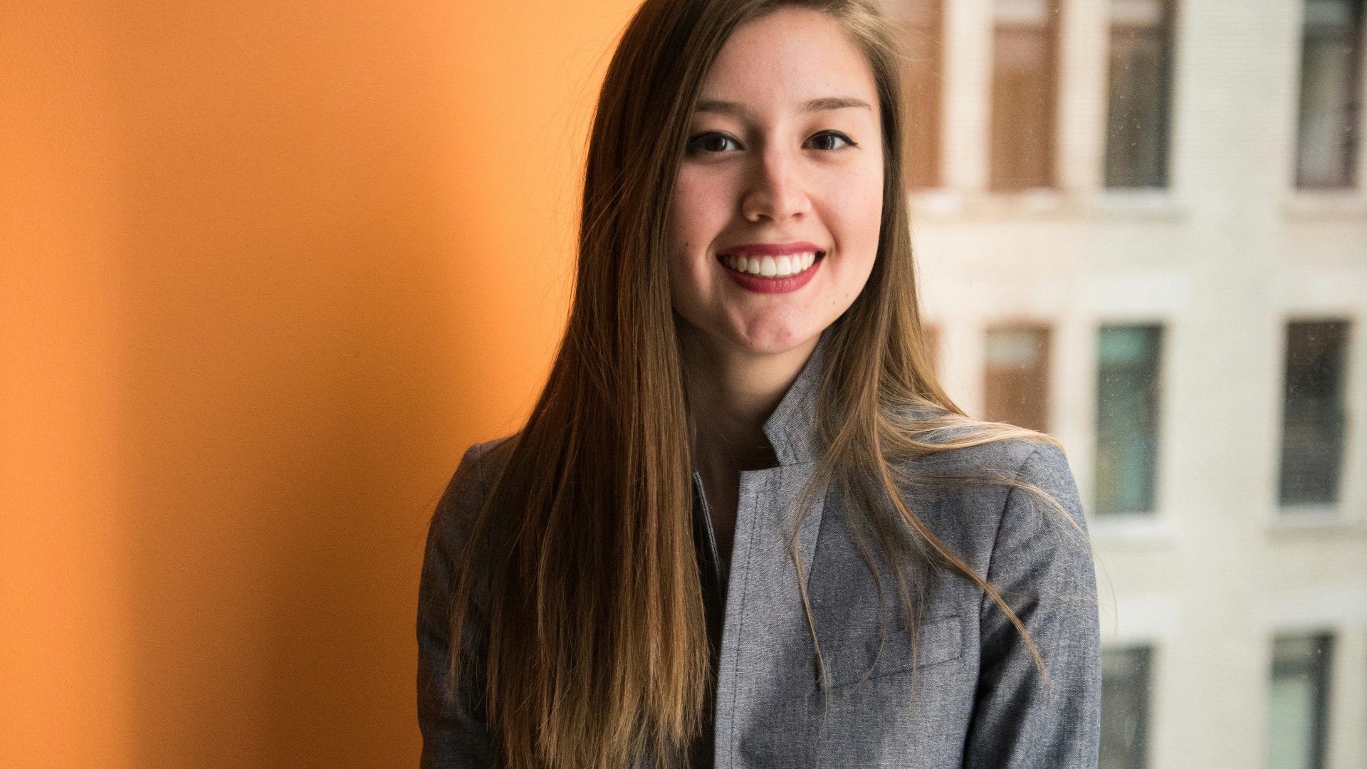 shallow focus photo of woman in gray jacket