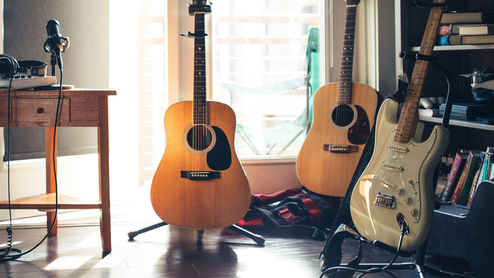 several guitars beside of side table