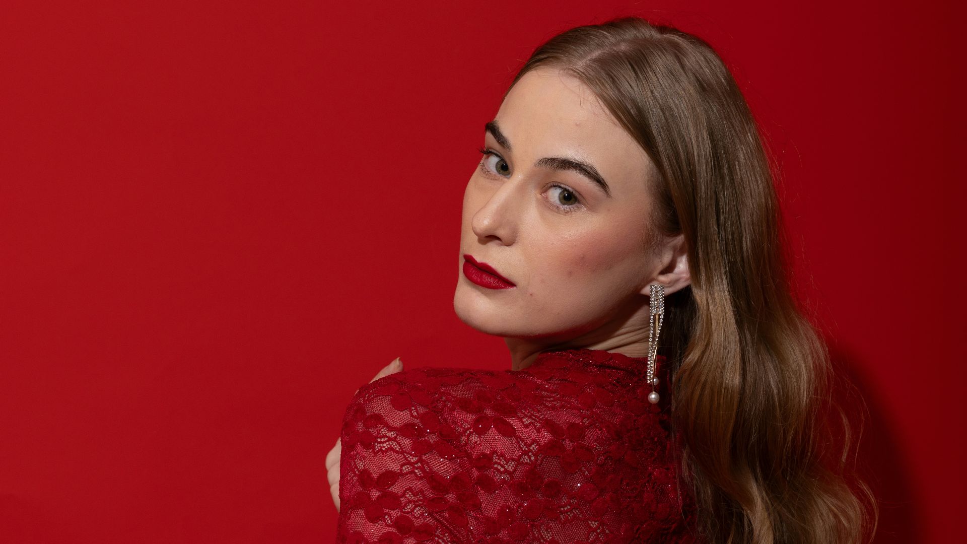 Woman in red dress with elegant jewelry