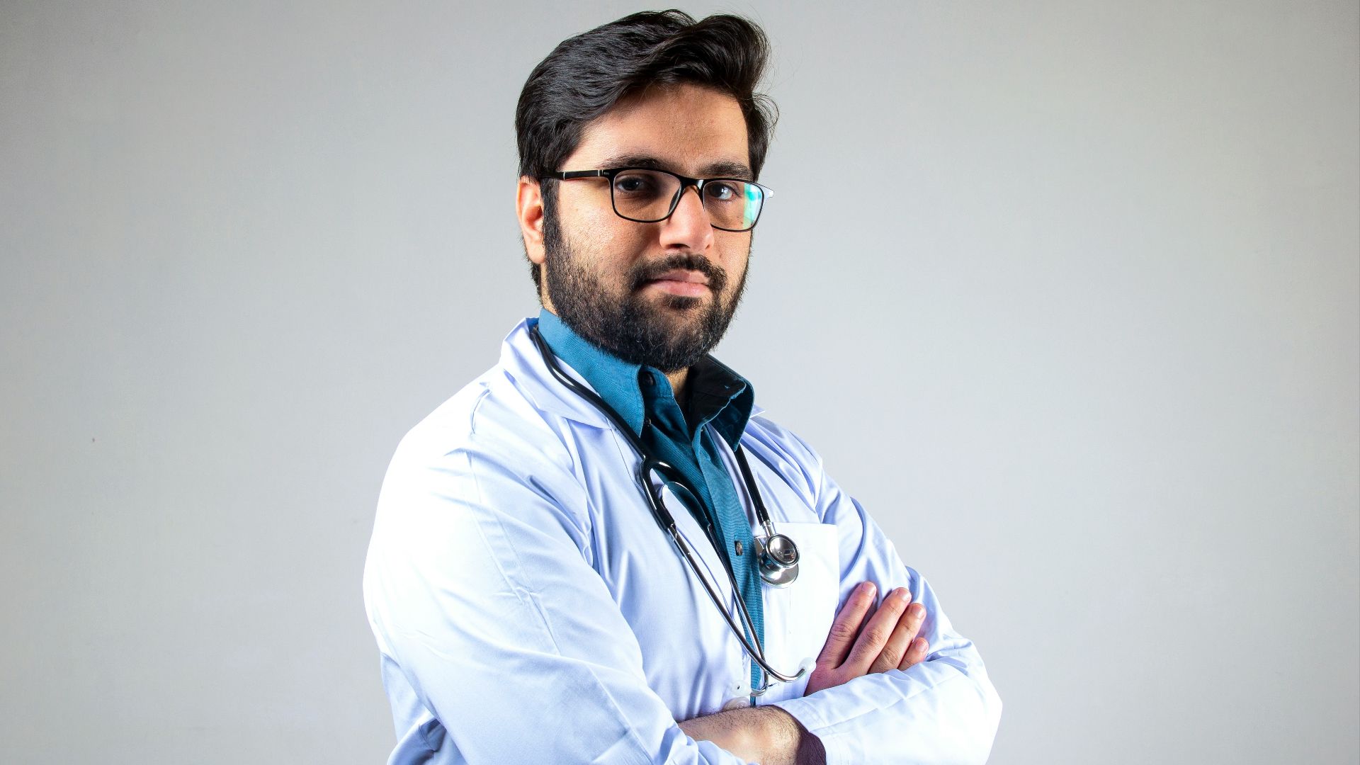 man in white dress shirt wearing black framed eyeglasses