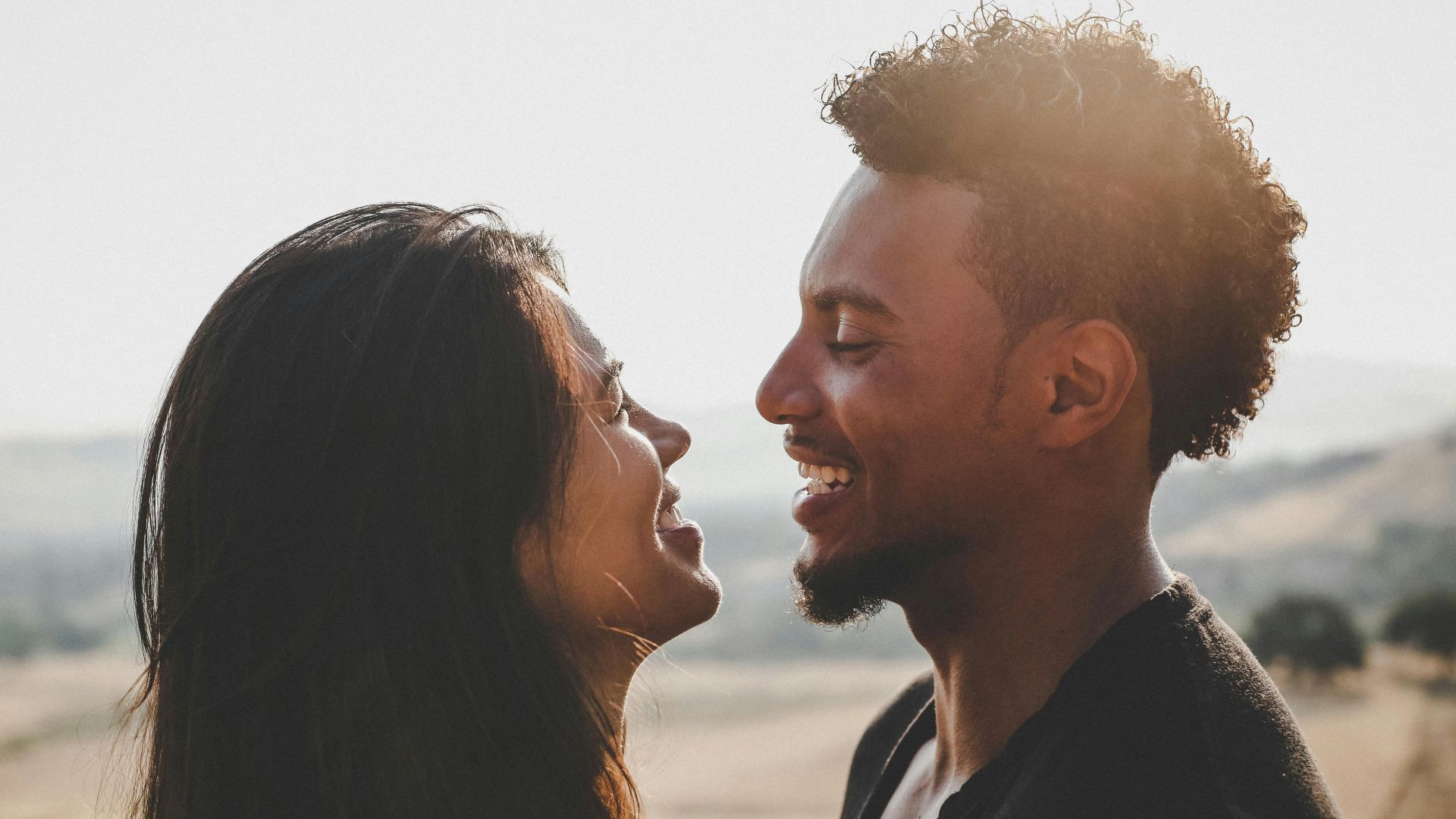 man and woman facing